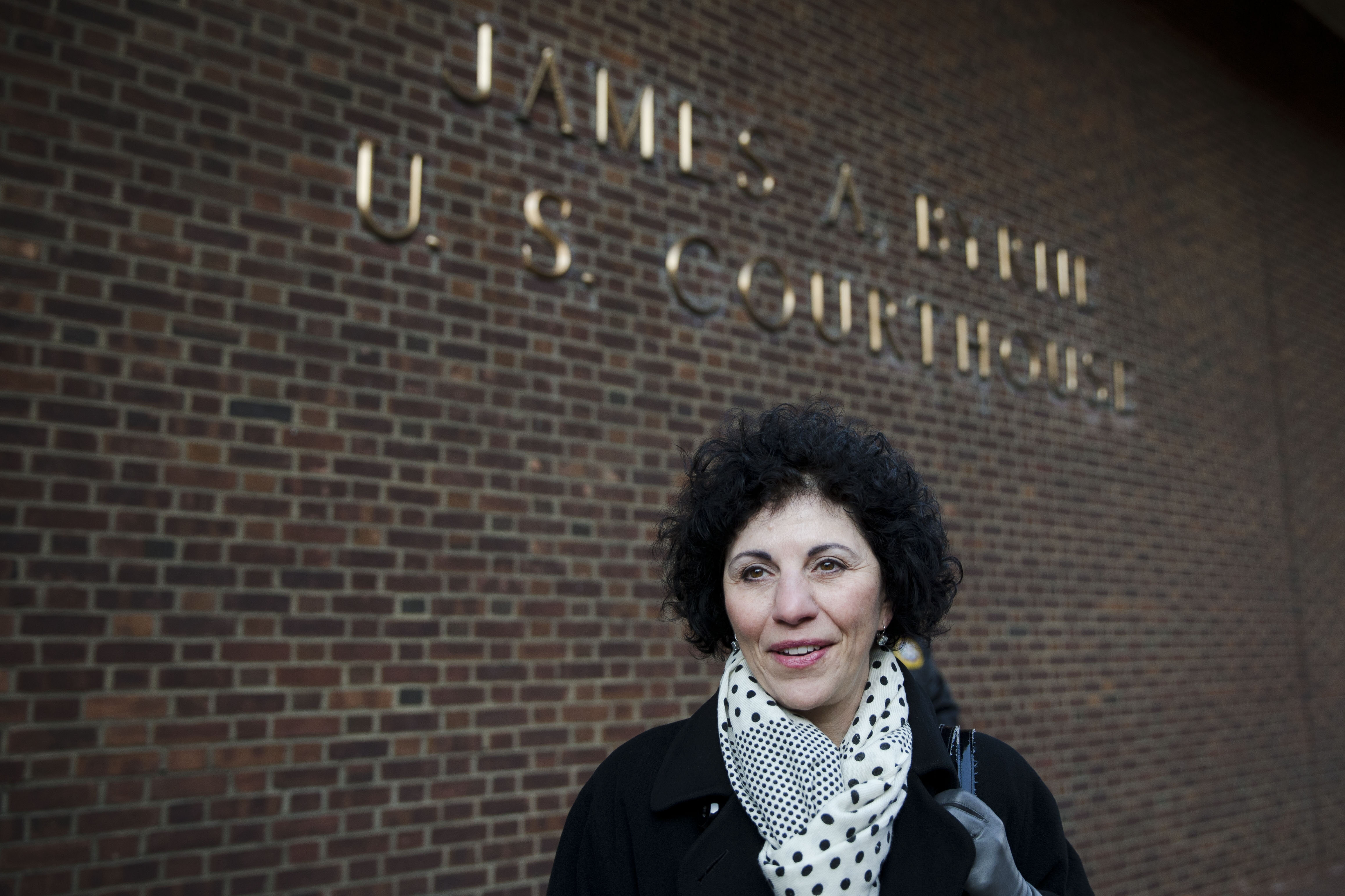 FILE - Eleanor Perfetto widow of NFL player Ralph Wenzel leaves the U.S. Courthouse after a hearing on the proposed NFL concussion settlement Wednesday, Nov. 19, 2014, in Philadelphia.