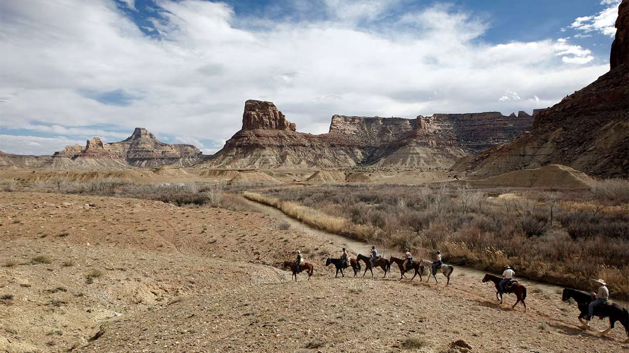 Riders traverse out of the Little Grand Canyon of the San Rafael Swell in Emery County on April 2, 2011.