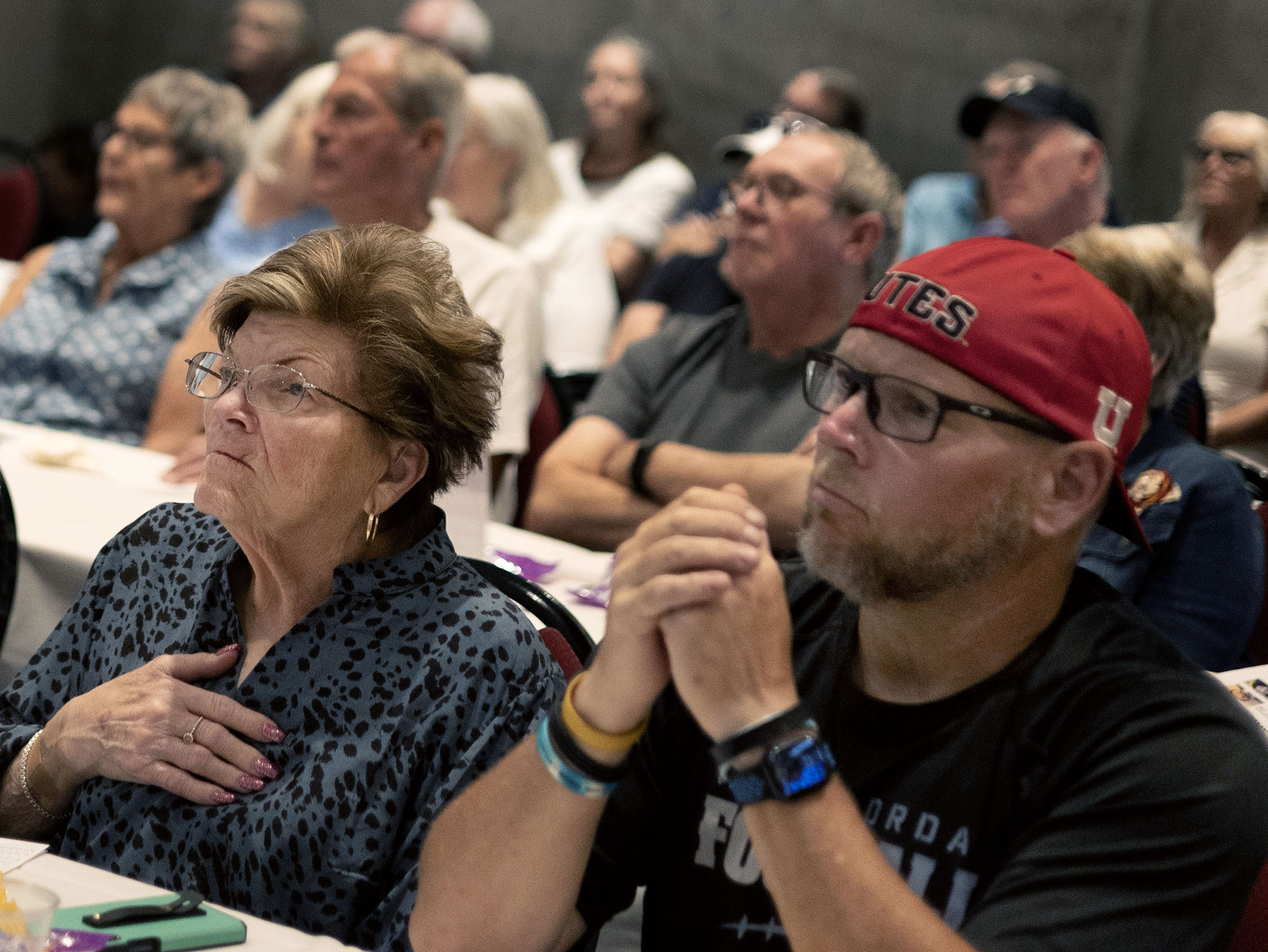 Troy Egbert and his mother, Marie Egbert, attend the AARP Scam Jam in Sandy on Wednesday.