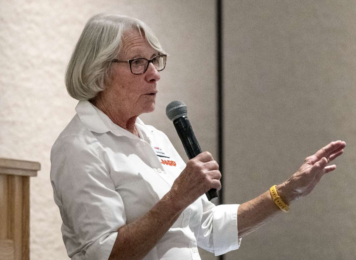 Sandy Hunter speaks about the toll scam at the AARP Scam Jam in Sandy on Wednesday.