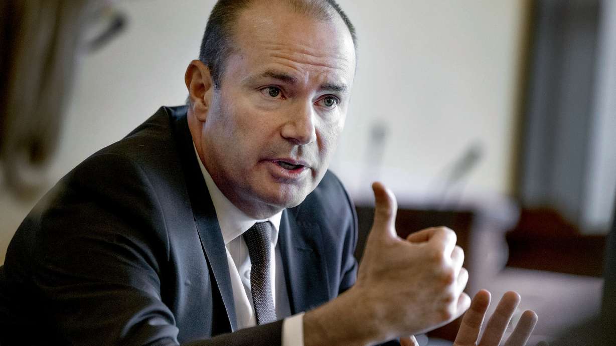 U.S. Sen. Mike Lee, R-Utah, speaks at the Capitol in Salt Lake City on Feb. 21, 2024. American hackers would be allowed to target foreign online threats and to recover money taken from Americans through online scams under a new bill proposed by Lee.