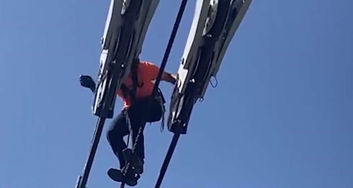 Mechanical crews work to resolve an issue on cables to a tram at Snowbird on Wednesday. Several families were stranded on the tram for a couple of hours.