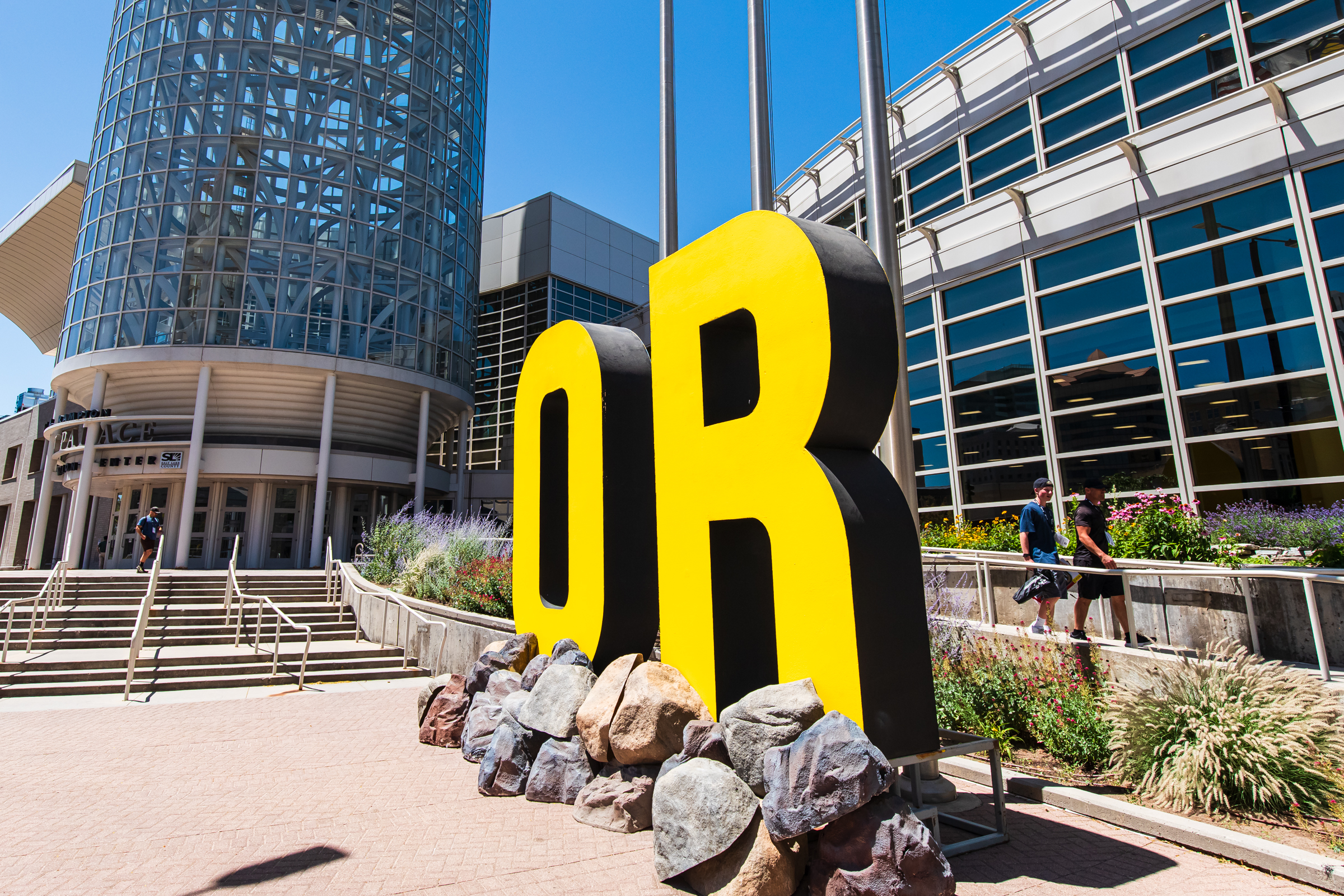 Outdoor Retailer attendees walk out of the Salt Palace Convention Center in Salt Lake City on Thursday.