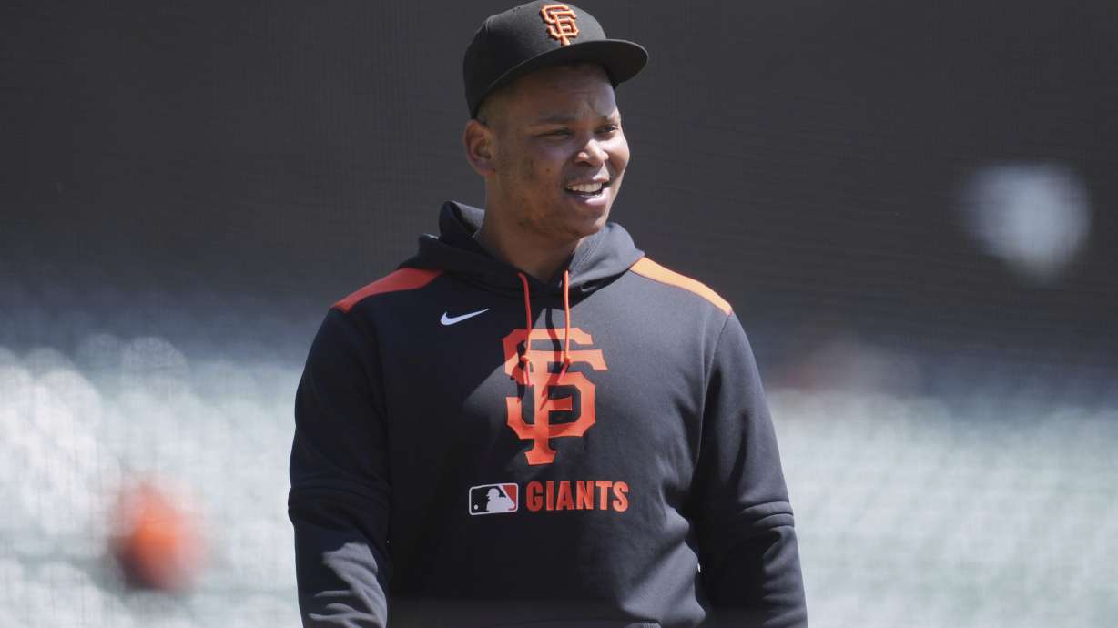 San Francisco Giants' Rafael Devers walks onto the field before a baseball game against the Cleveland Guardians in San Francisco, Thursday, June 19, 2025.