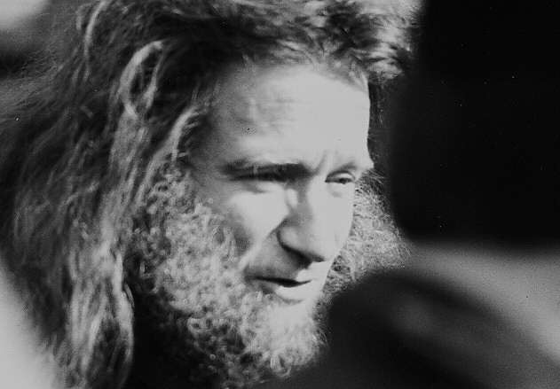 Actor Robin Williams takes a break from a make-up session to speak with locals watching the filming of Jumanji on Nov. 15, 1994 in Keene, N.H.
