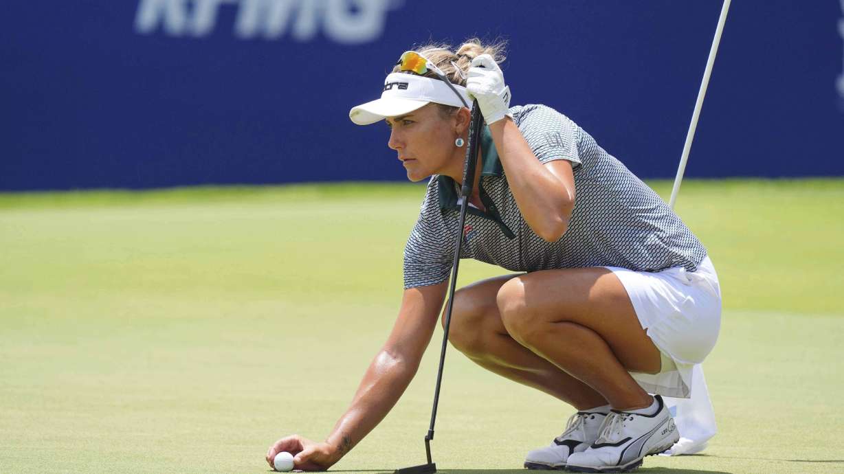 Lexi Thompson lines up a putt on the 18th hole during the second round of the Women's PGA Championship golf tournament Friday, June 20, 2025, in Frisco, Texas.