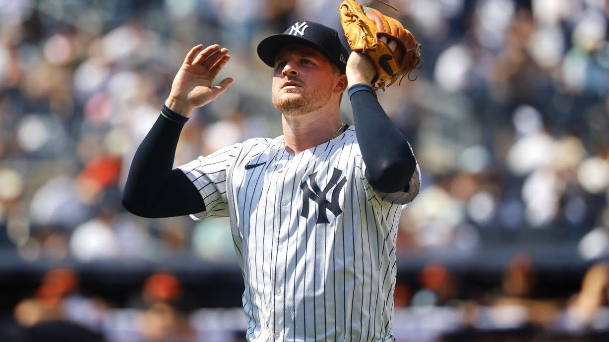 New York Yankees pitcher Clarke Schmidt reacts as he heads to the dugout in the seventh inning of a baseball game against the Baltimore Orioles, Saturday, June 21, 2025, in New York.