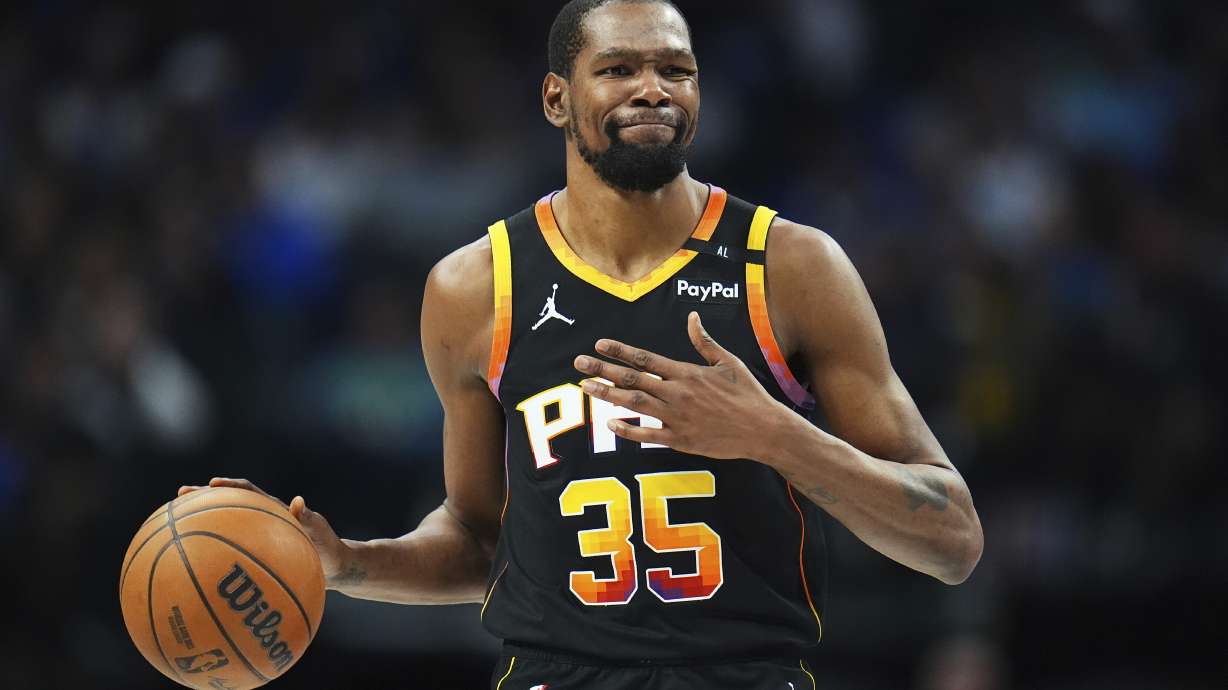 FILE - Phoenix Suns forward Kevin Durant gestures during the second half of an NBA basketball game on March 9, 2025, in Dallas.