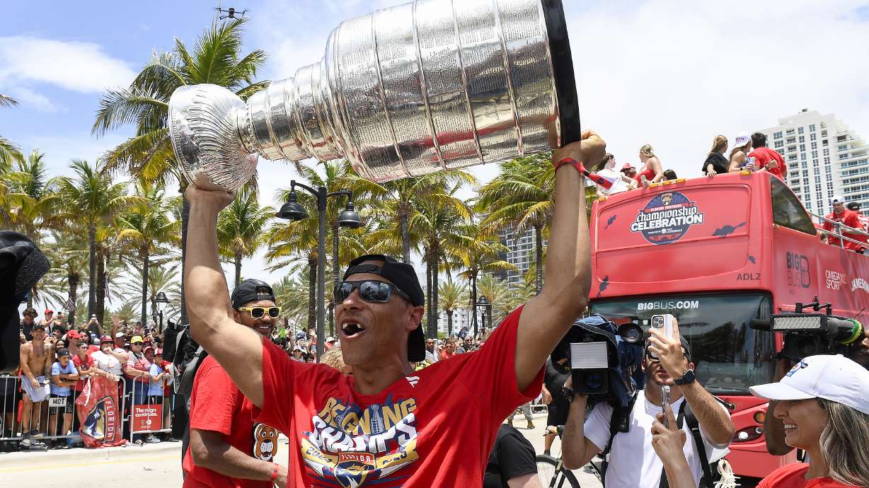 Florida Panthers Brad Marchand walks the parade route with the Stanley Cup trophy during the Panthers 2025 Championship Celebration, Sunday, June 20, 2022, in Fort Lauderdale, Fla.