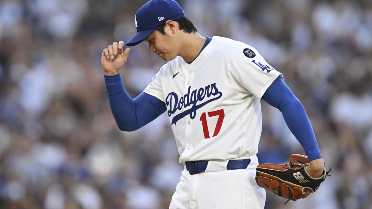Los Angeles Dodgers starting pitcher Shohei Ohtani prepares to pitch during the first inning of a baseball game against the San Diego Padres, Monday, June 16, 2025, in Los Angeles.