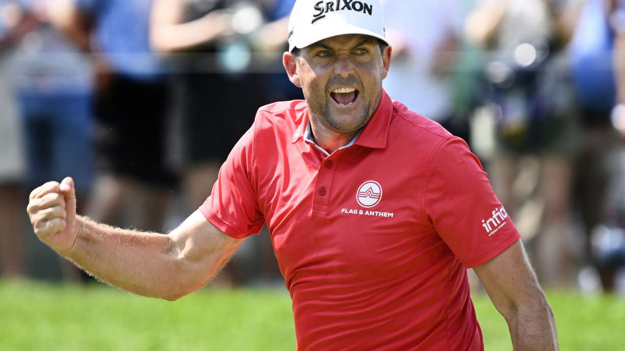 Keegan Bradley reacts to making birdie putt to a tie for the lead on the ninth hole during the final round of the Travelers Championship golf tournament at TPC River Highlands, Sunday, June 22, 2025, in Cromwell, Conn.