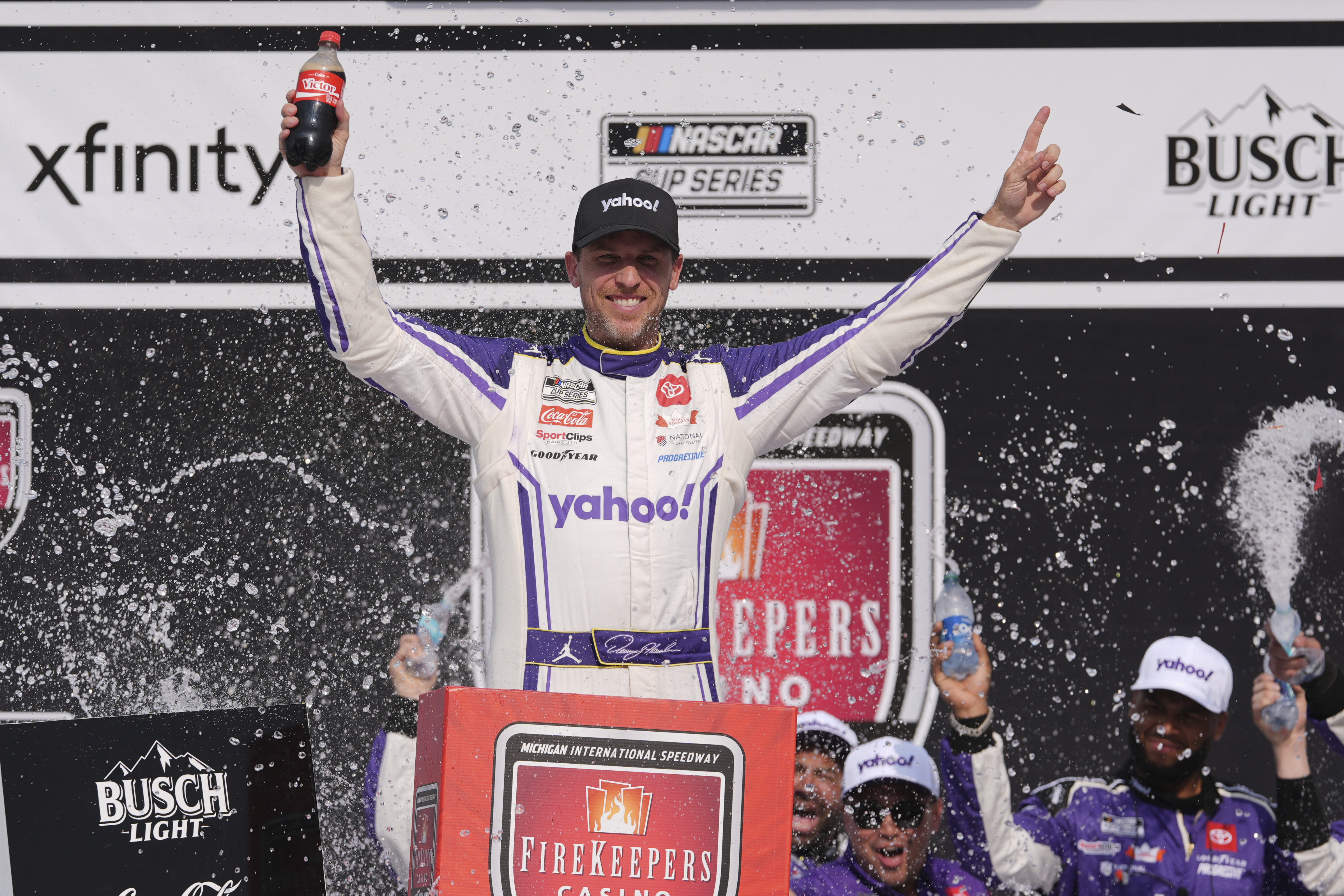 Denny Hamlin celebrates his victory in a NASCAR Cup Series auto race at Michigan International Speedway in Brooklyn, Mich., Sunday, June 8, 2025.