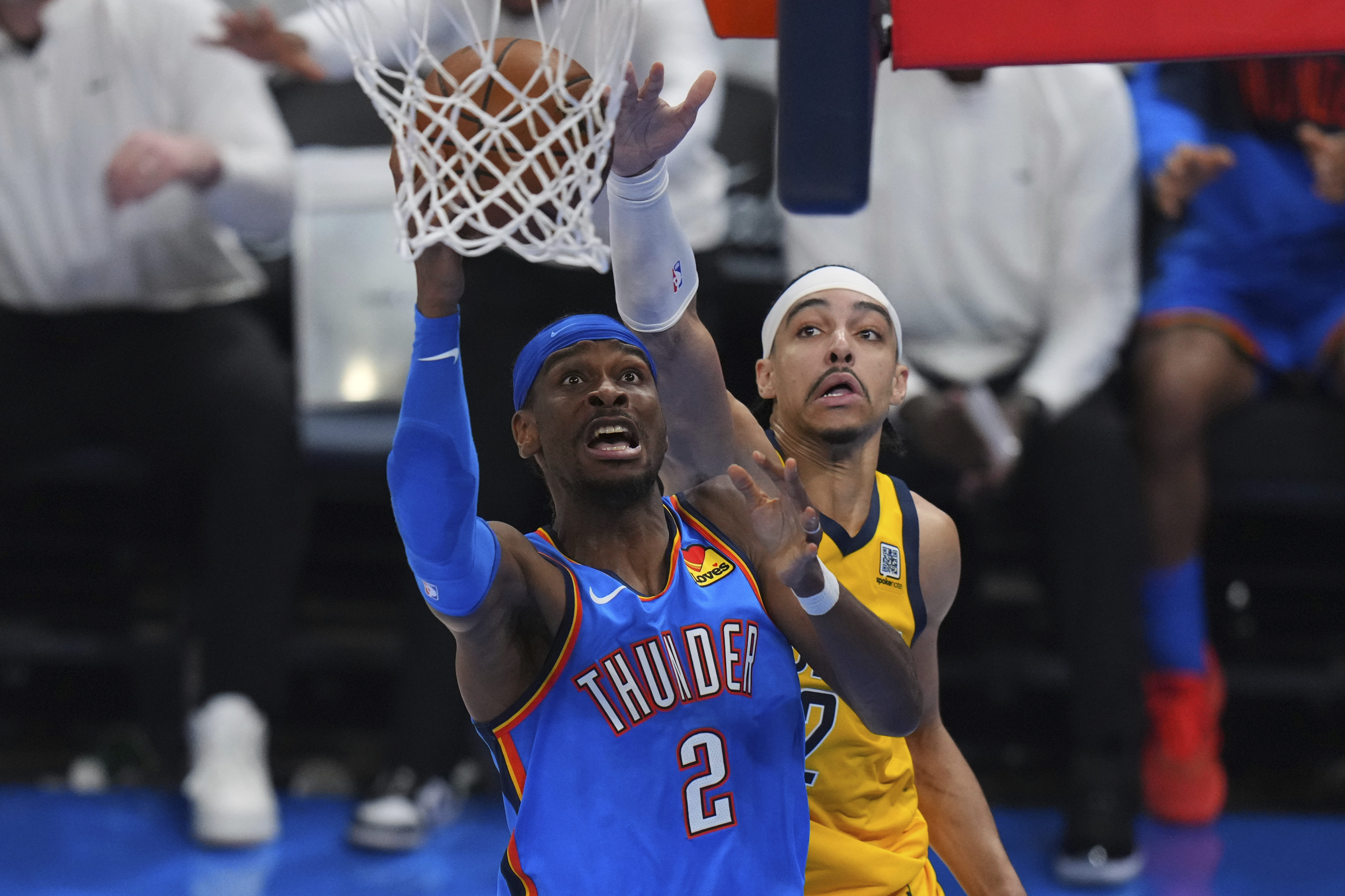 Oklahoma City Thunder guard Shai Gilgeous-Alexander, left, shoots against Indiana Pacers guard Andrew Nembhard during the second half of Game 7 of the NBA Finals basketball series Sunday, June 22, 2025, in Oklahoma City.