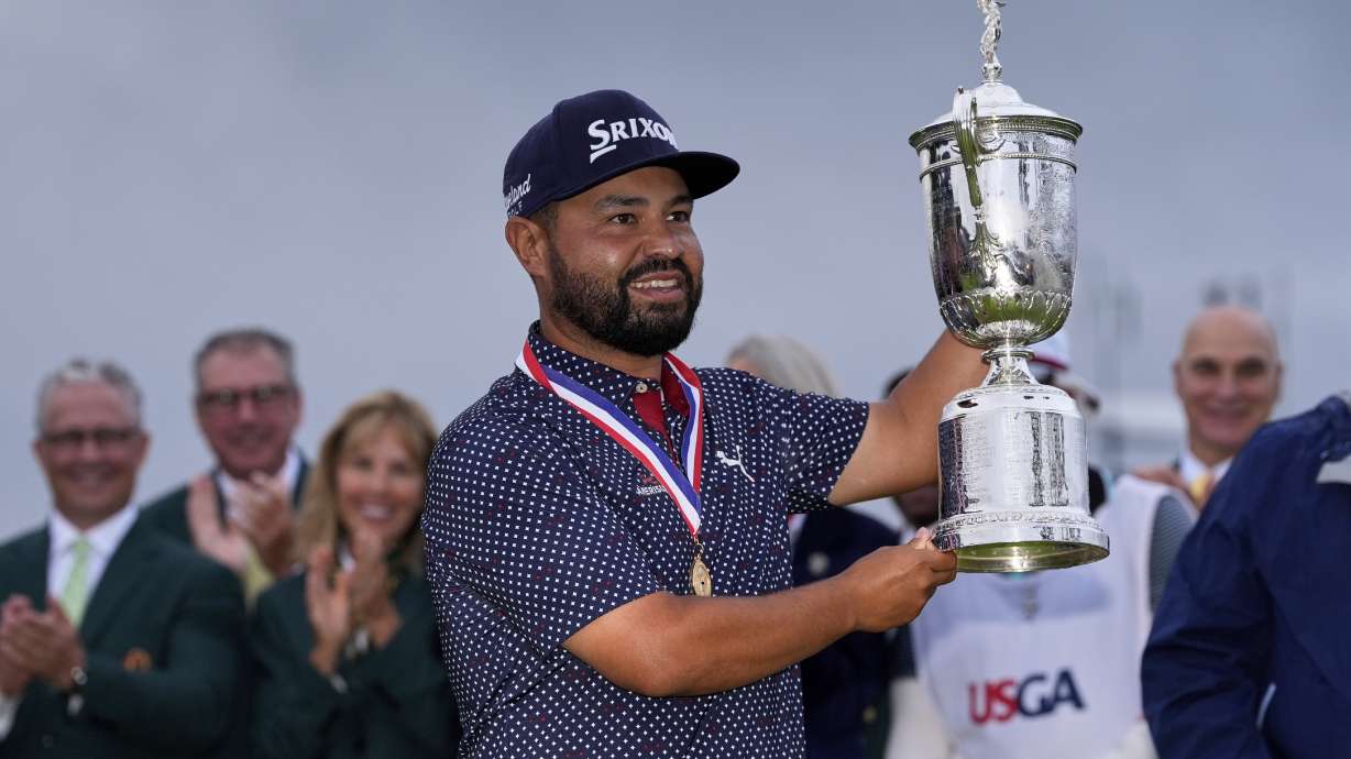 J.J. Spaun celebrates with the trophy after winning the U.S. Open golf tournament at Oakmont Country Club Sunday, June 15, 2025, in Oakmont, Pa.