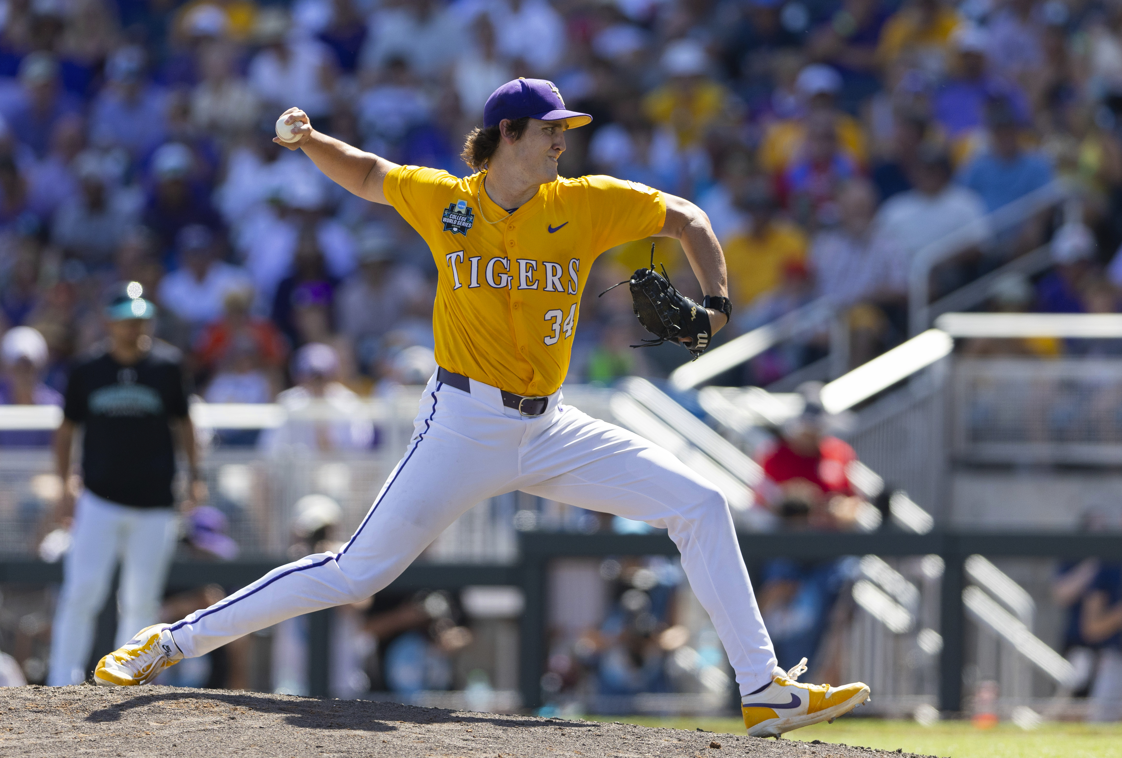 LSU's Chase Shores pitches against Coastal Carolina in the seventh inning of Game 2 of the NCAA College World Series baseball finals in Omaha, Neb., Sunday, June 22, 2025.