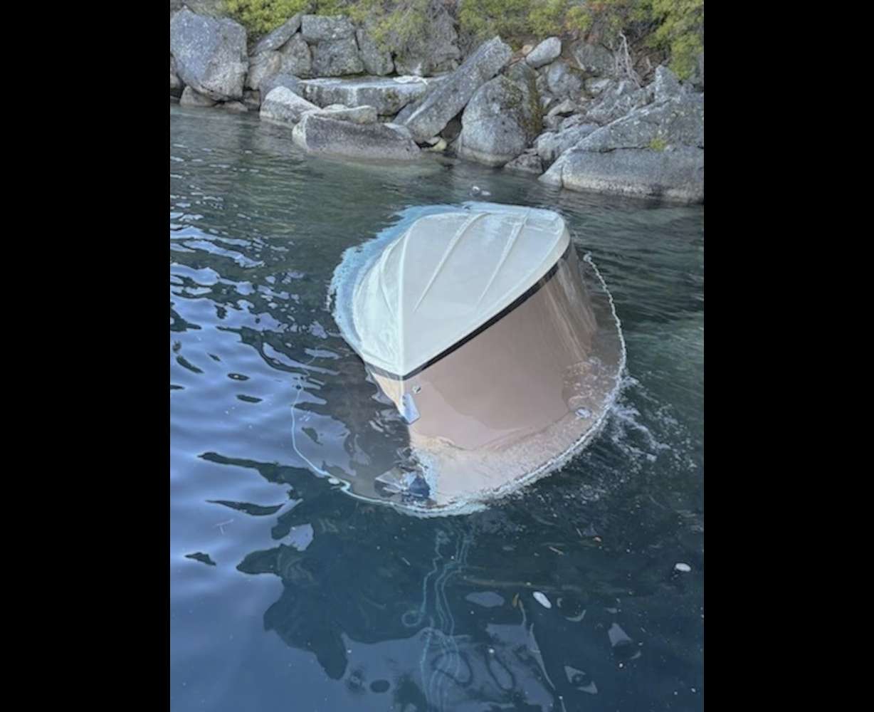 A capsized vessel floats near D.L. Bliss State Park at Lake Tahoe, Calif., Saturday.