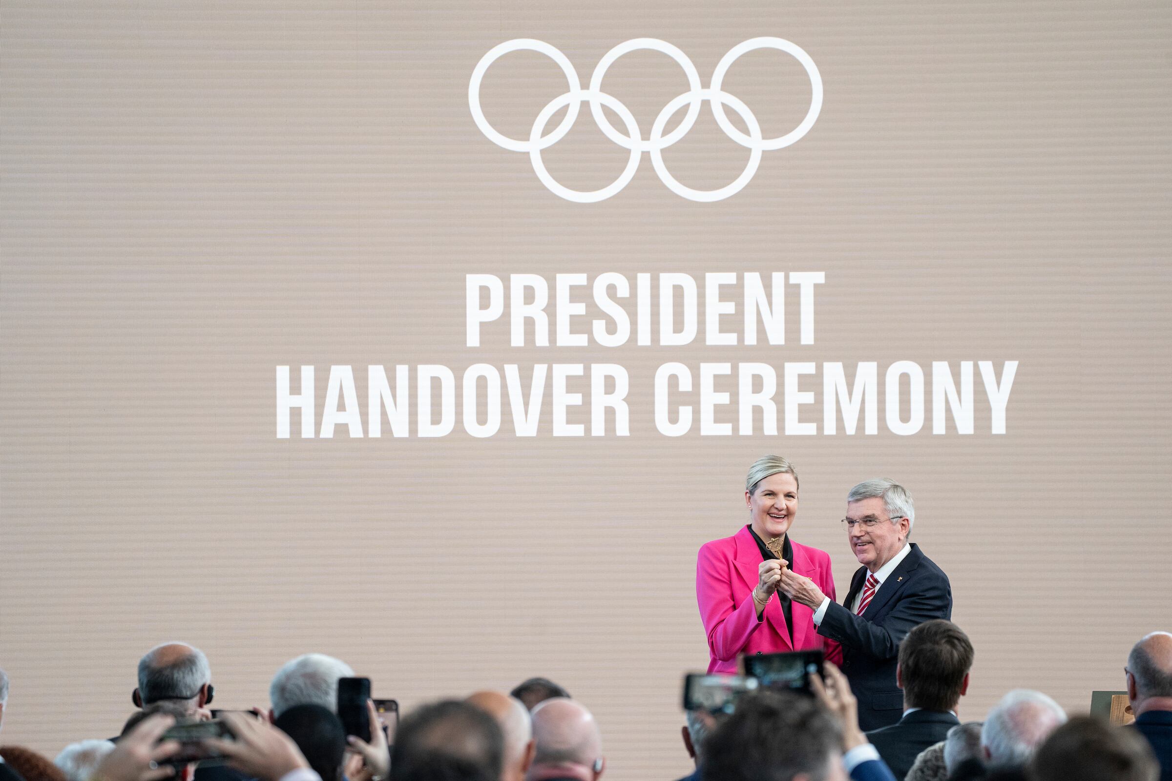 International Olympic Committee President Thomas Bach, right, and President-elect Kirsty Coventry pose with the symbolic key of the Olympic House in Lausanne, Switzerland, on Monday.