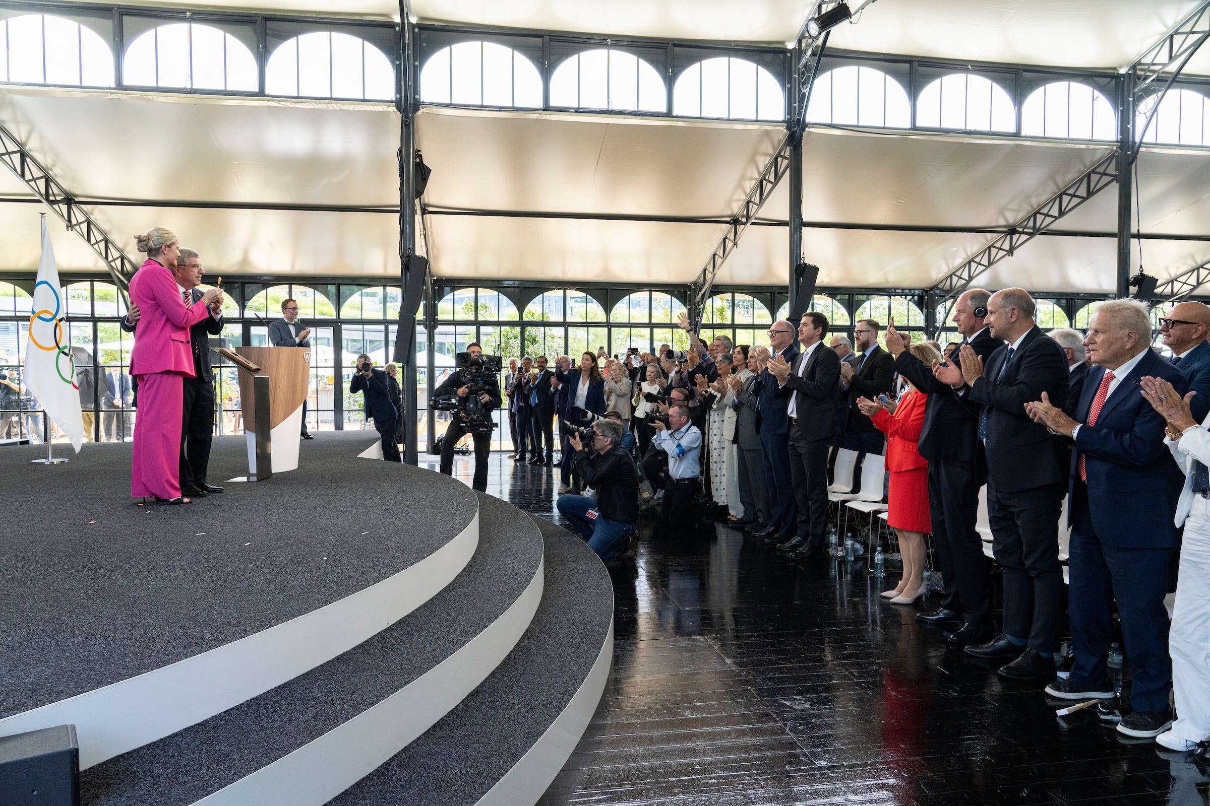 International Olympic Committee President-elect Kirsty Coventry, foreground, and outgoing President Thomas Bach pose with the symbolic key of the Olympic House during the handover ceremony of the IOC Presidency at the Olympic House in Lausanne, Switzerland, on Monday.