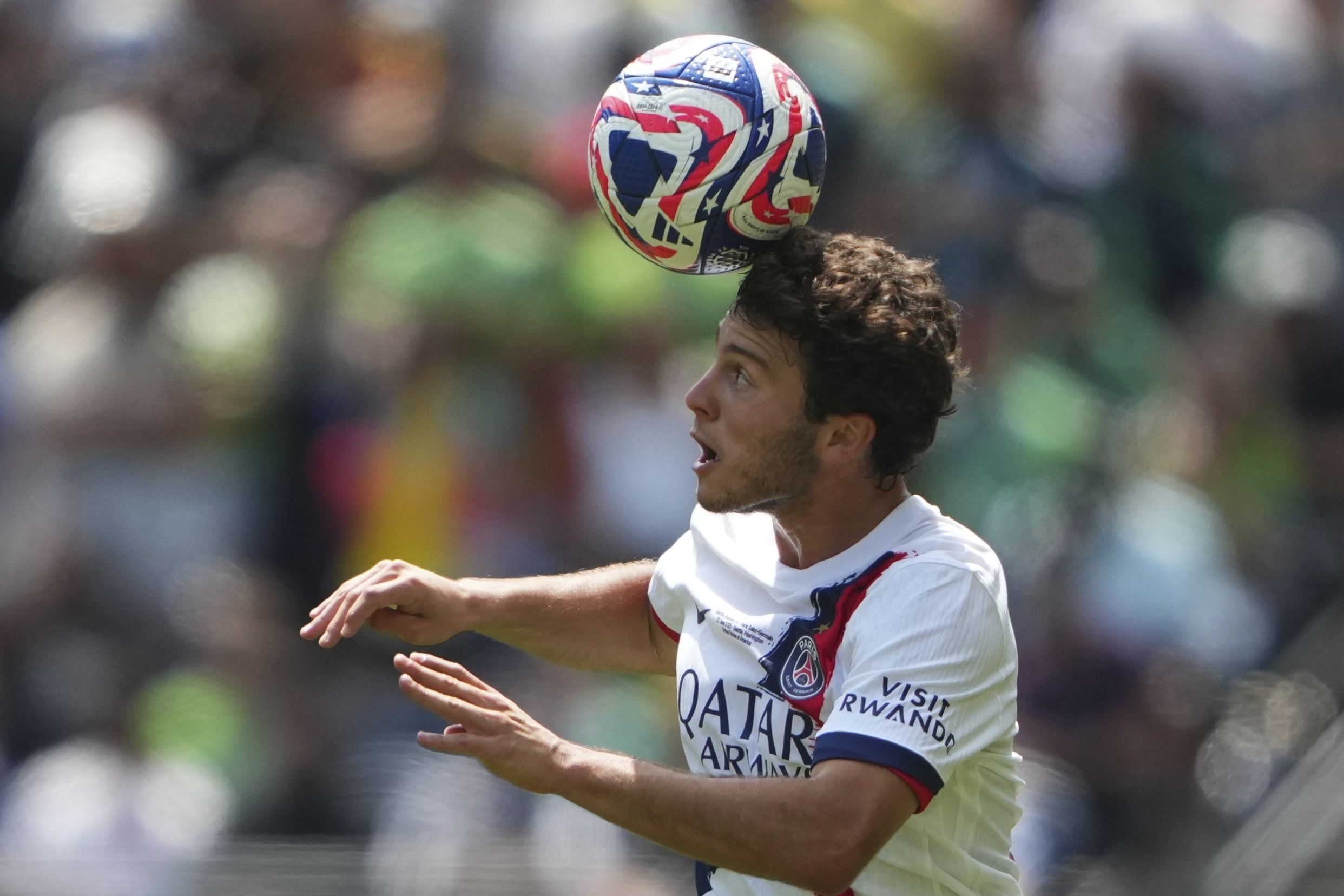 Paris Saint-Germain's Joao Neves heads the ball during the Club World Cup Group B soccer match between Seattle Sounders and PSG in Seattle, Monday, June 23, 2025.
