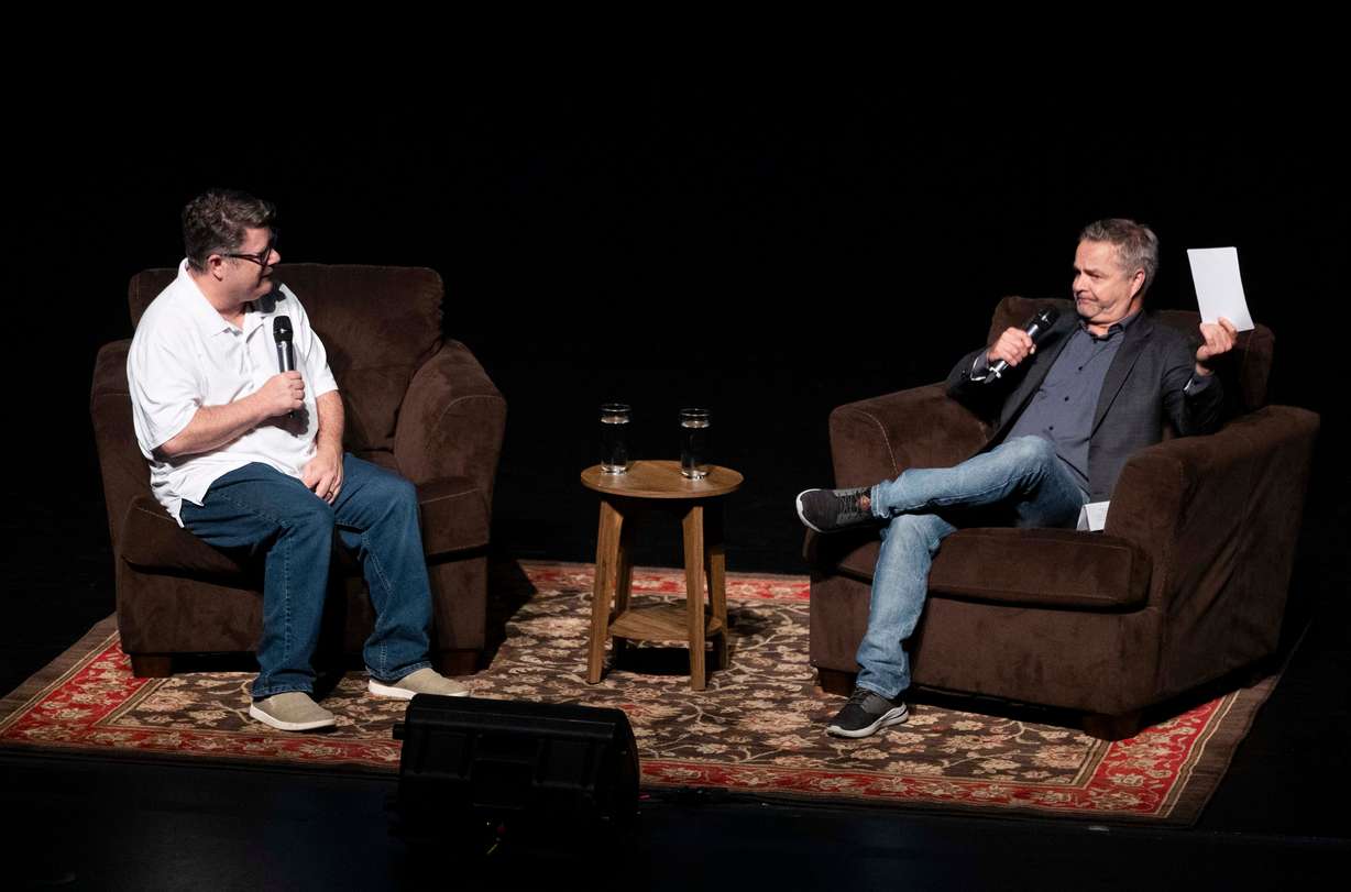 Sean Astin, left, and Andrew Lenz, right, talk with each other during a moderated discussion following a 40th anniversary screening of The Goonies at Kingsbury Hall on the campus of the University of Utah in Salt Lake City on Saturday.