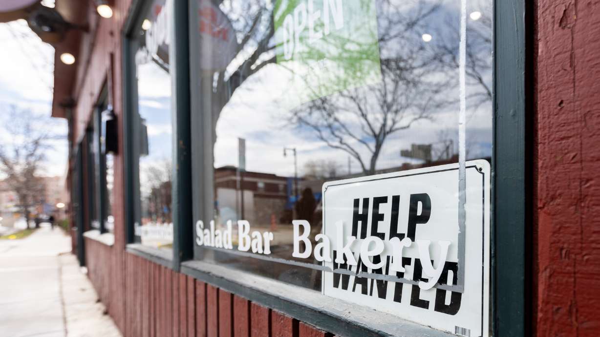 A Help Wanted sign is seen in Salt Lake City on Feb. 9, 2024. Despite year-over-year job growth and an unemployment rate better than the national average, experts say there are signs that Utah's economy might be starting to slow down.