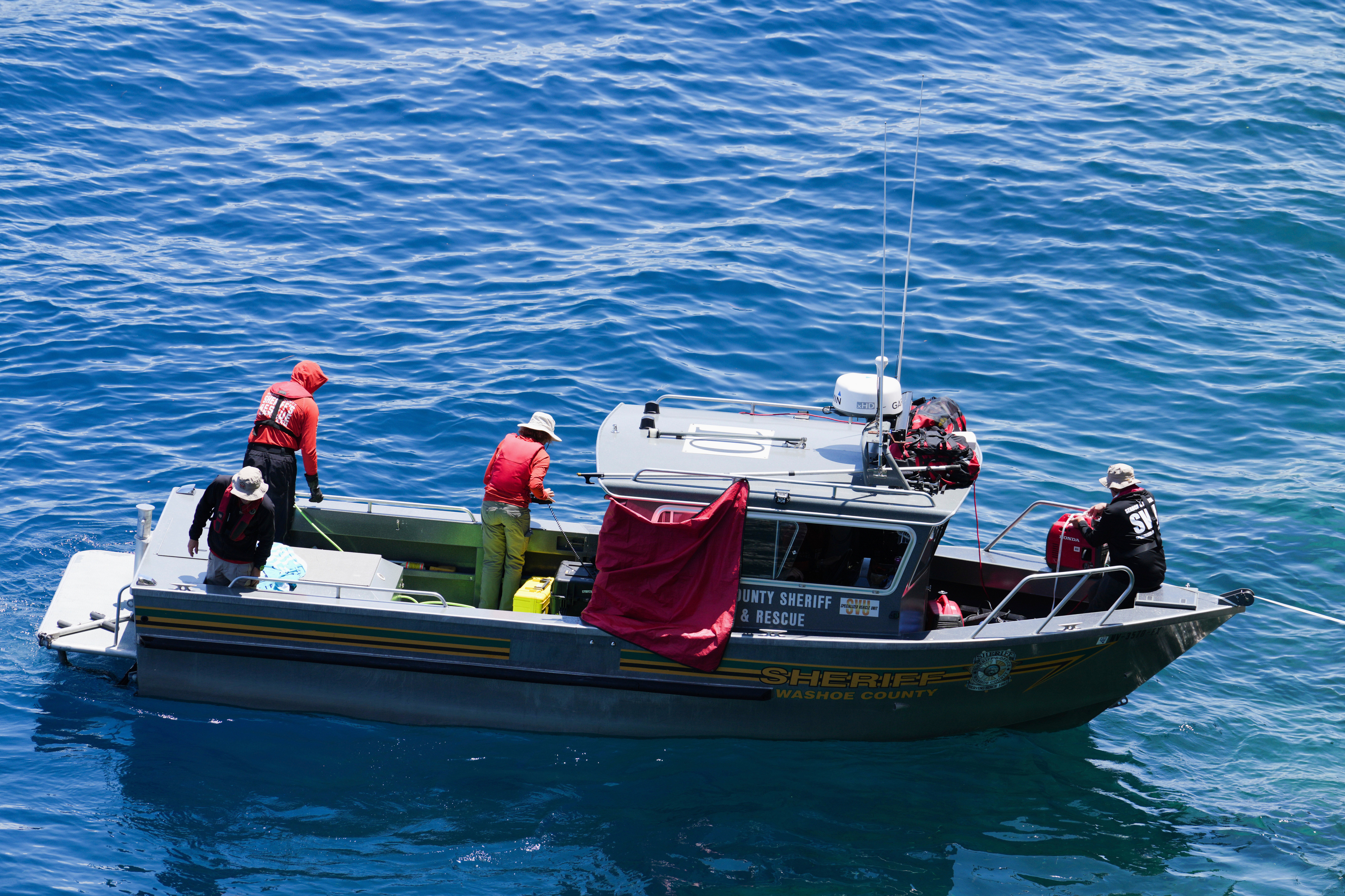 Washoe County Sheriffs conduct a search at D.L. Bliss State Park after a weekend incident in which a boat capsized, killing several people, on Monday, in Lake Tahoe, Calif.