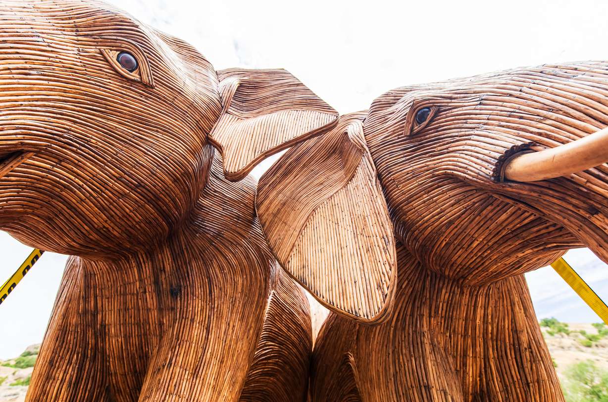 Two elephant sculptures, part of the the Great Elephant Migration traveling art exhibit, are displayed at Warm Springs Park in Salt Lake City on Monday.