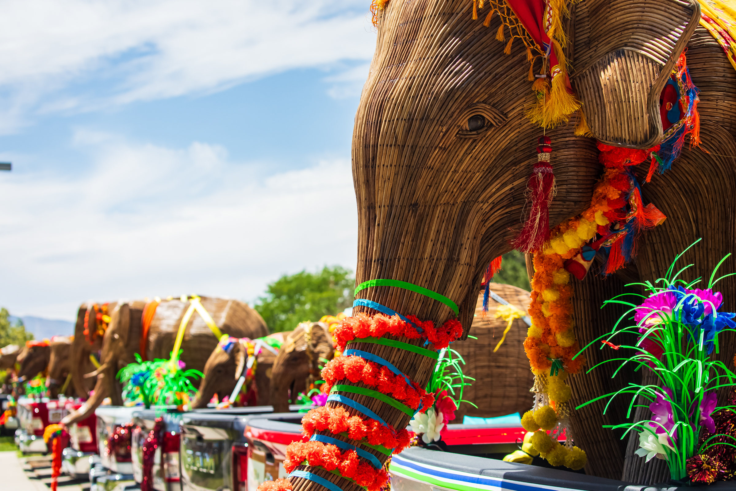 An elephant sculpture, part of the Great Elephant Migration exhibit, is displayed on the back of a pickup truck parked at Warm Springs Park in Salt Lake City on Monday.