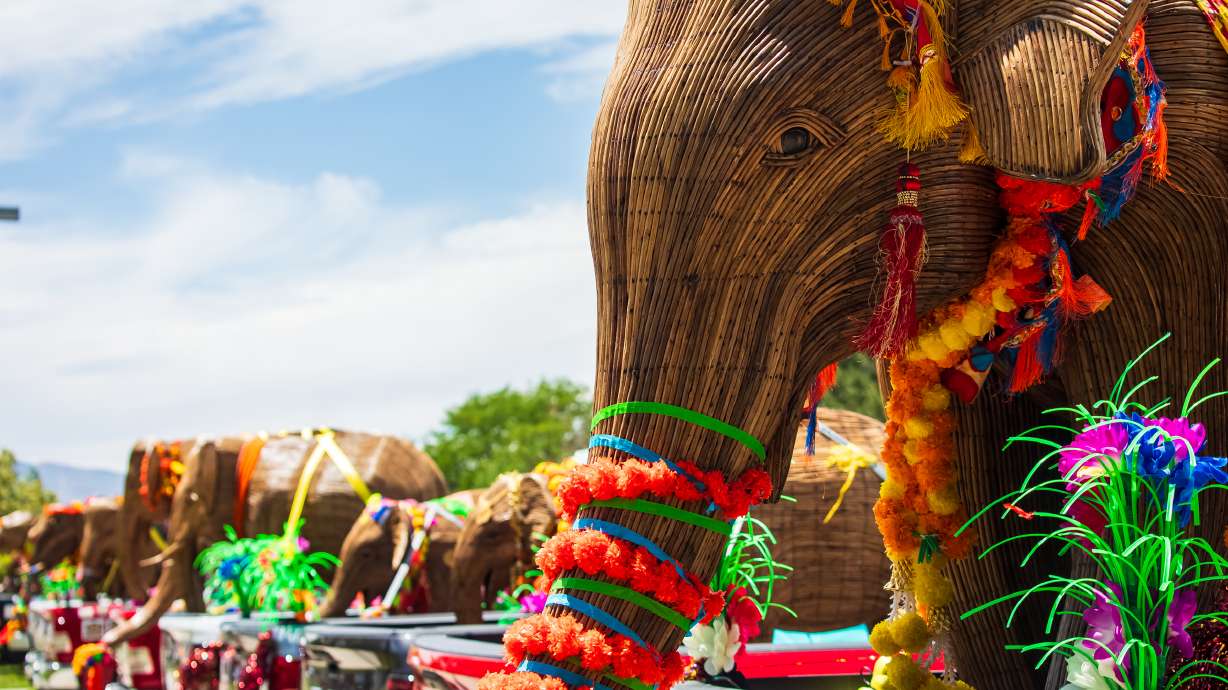 An elephant sculpture, part of the Great Elephant Migration exhibit, is displayed on the back of a pickup truck parked at Warm Springs Park in Salt Lake City on Monday.