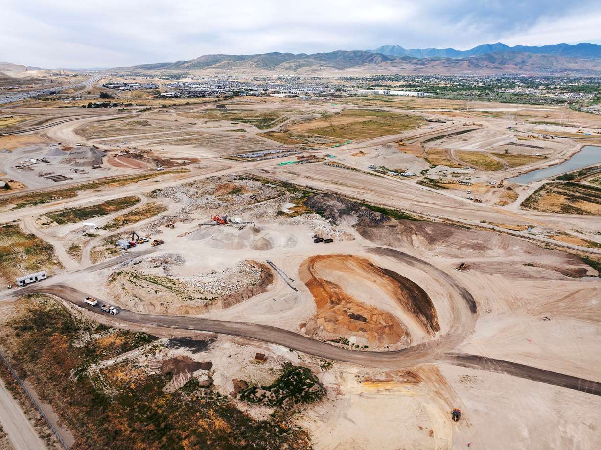 Work moves on at The Point, the former location of the State Prison, on Monday. Utah officials are readying to issue a contract for tapping into a geothermal reservoir to help development of the project.