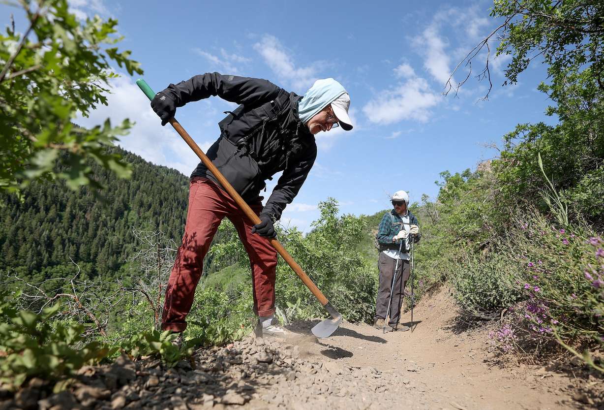 Volunteers Eric Hodgson and Cole Dugdale, Cottonwood Canyons Foundation trail crew members, do trail work on the Burch Hollow Trail in Millcreek Canyon on June 6.