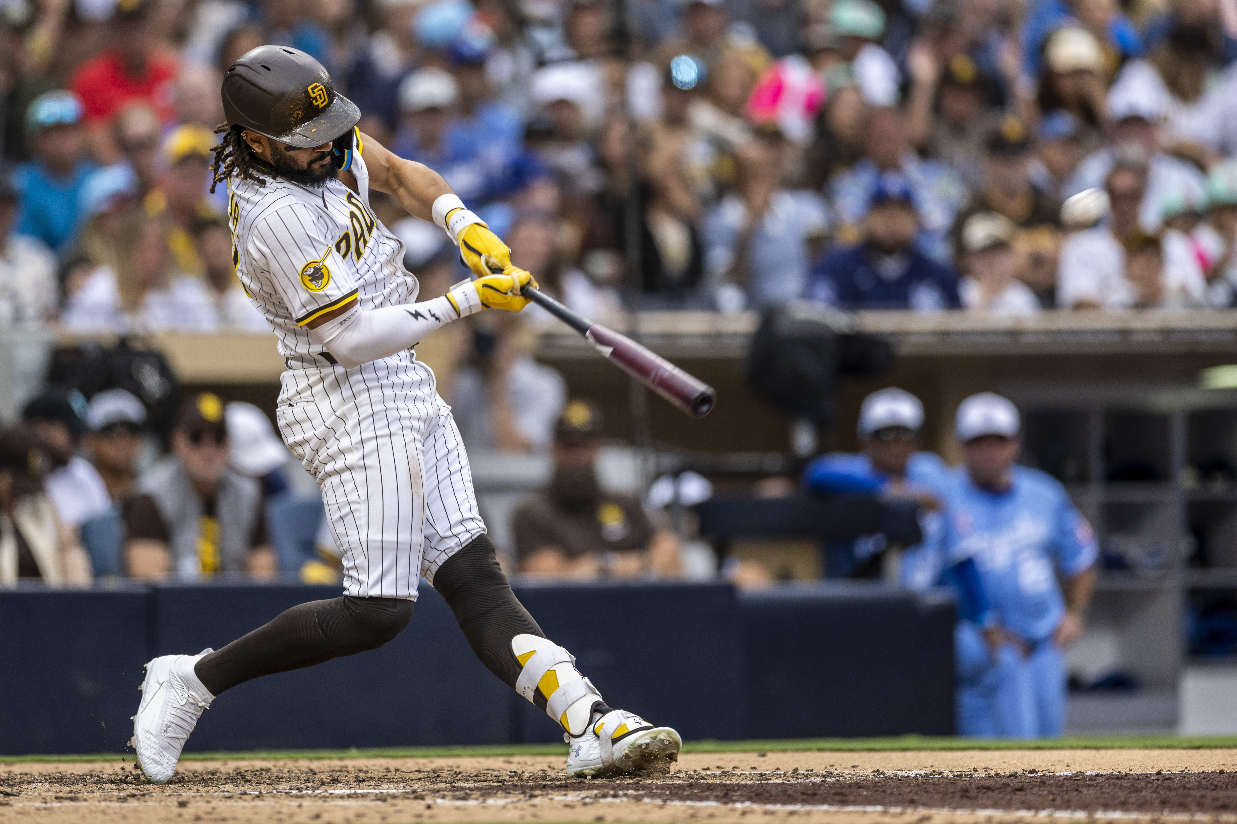 San Diego Padres' Fernando Tatis Jr. hits a home run in the seventh inning of a baseball game against the Kansas City Royals, Saturday, June 21, 2025, in San Diego.