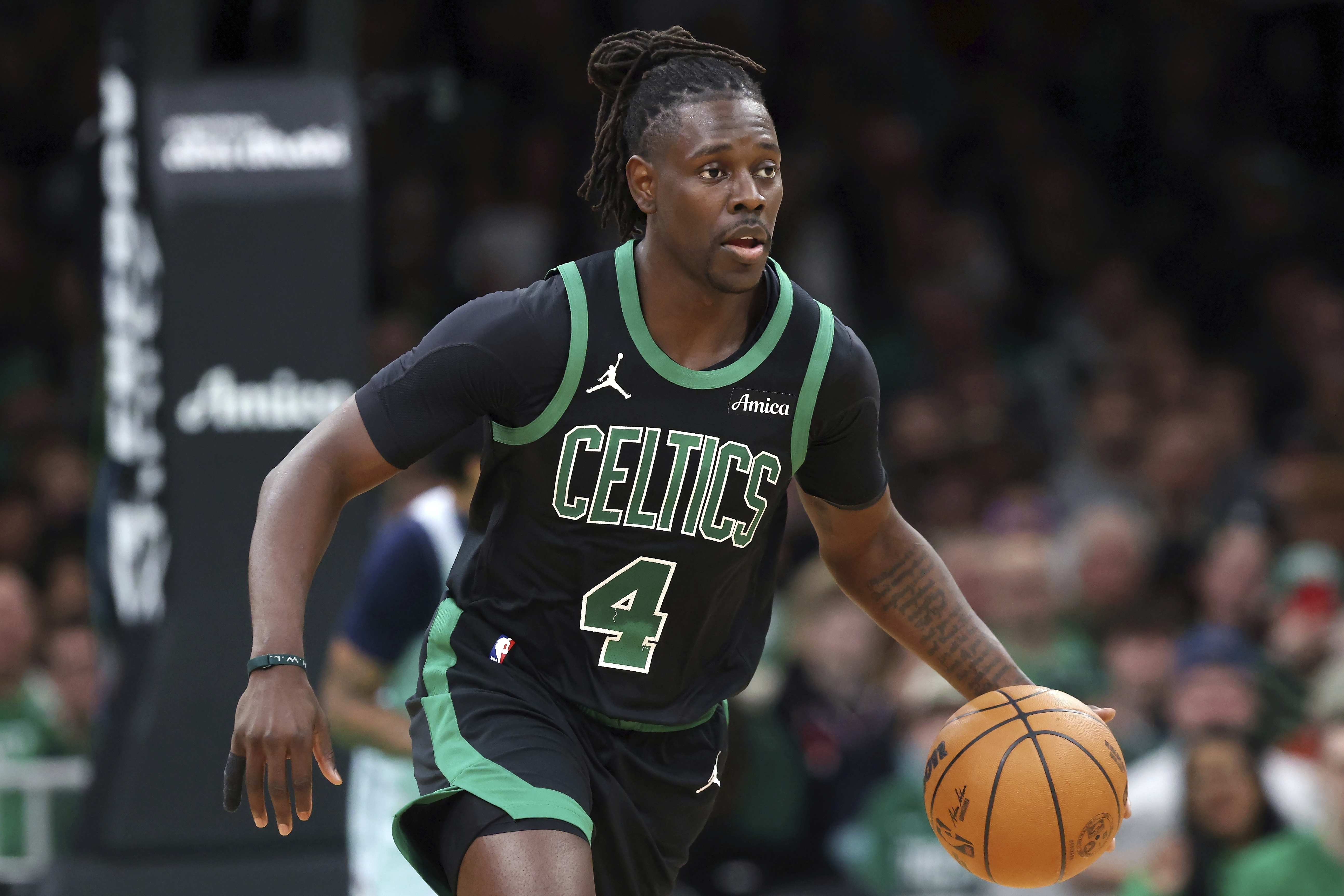 FILE - Boston Celtics' Jrue Holiday plays against the Washington Wizards during the first half of an NBA basketball game on April 6, 2025, in Boston.