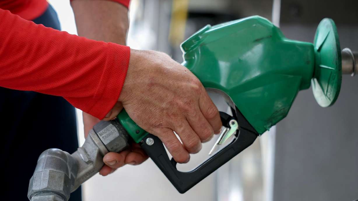 Arley Perez pumps diesel fuel into his truck at a Shell station on April 10 in Miami, Florida. Oil futures tumbled again Tuesday on hopes that the shaky ceasefire between Israel and Iran would reduce the risk of any big disruption to global energy markets.