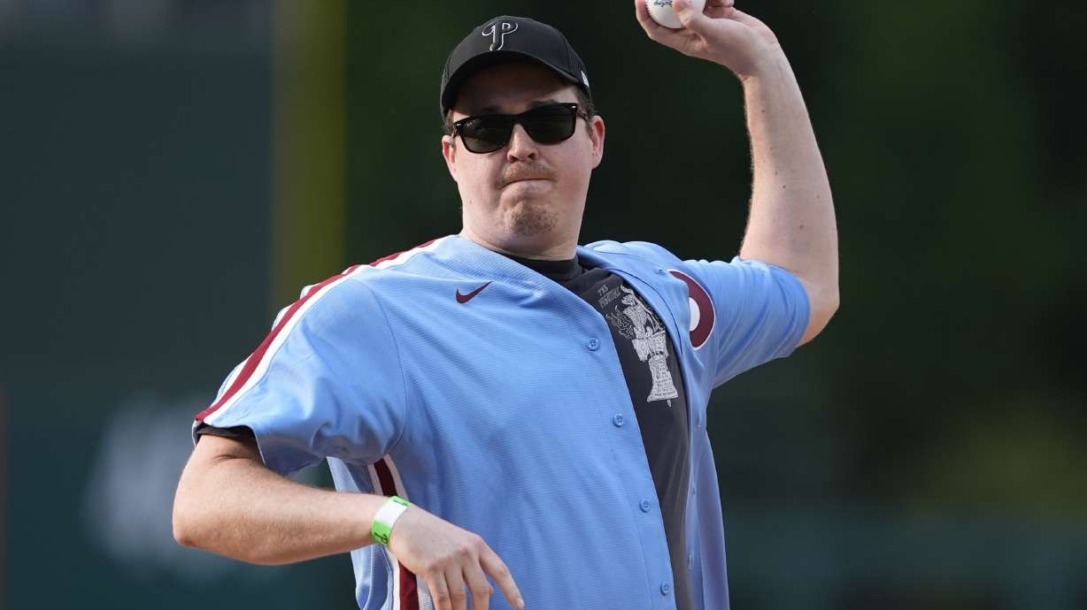 FILE - Comedian Shane Gillis throws out a pitch before a baseball game between the Philadelphia Phillies and the Texas Rangers, Wednesday, May 22, 2024, in Philadelphia.