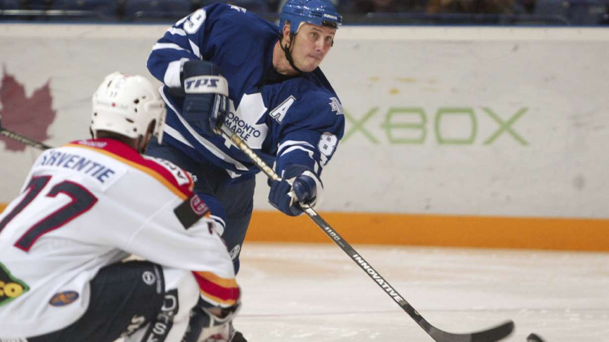 FILE - Finnish hockey team Jokerit's Martti Jarventie, left, and Toronto Maple Leaf's Alexander Mogilny compete for the puck during their friendly ice hockey match played in Helsinki, Finland, Sept. 16, 2003.