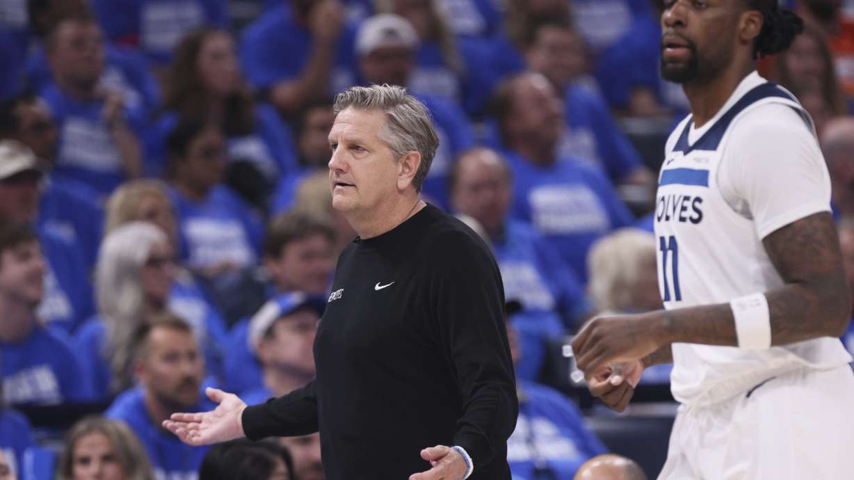 Minnesota Timberwolves head coach Chris Finch reacts next to center Naz Reid (11) during the first half of Game 5 of the Western Conference finals of the NBA basketball playoffs against the Oklahoma City Thunder, Wednesday, May 28, 2025, in Oklahoma City.