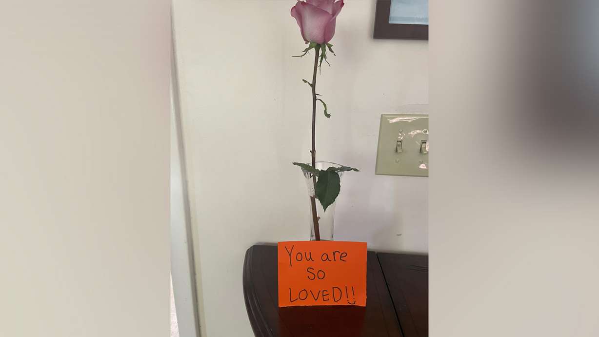 A note and a rose Nancy Lawrence received from a stranger last week now sit in her home, reminding her to keep fighting through her own personal battles of day-to-day life.