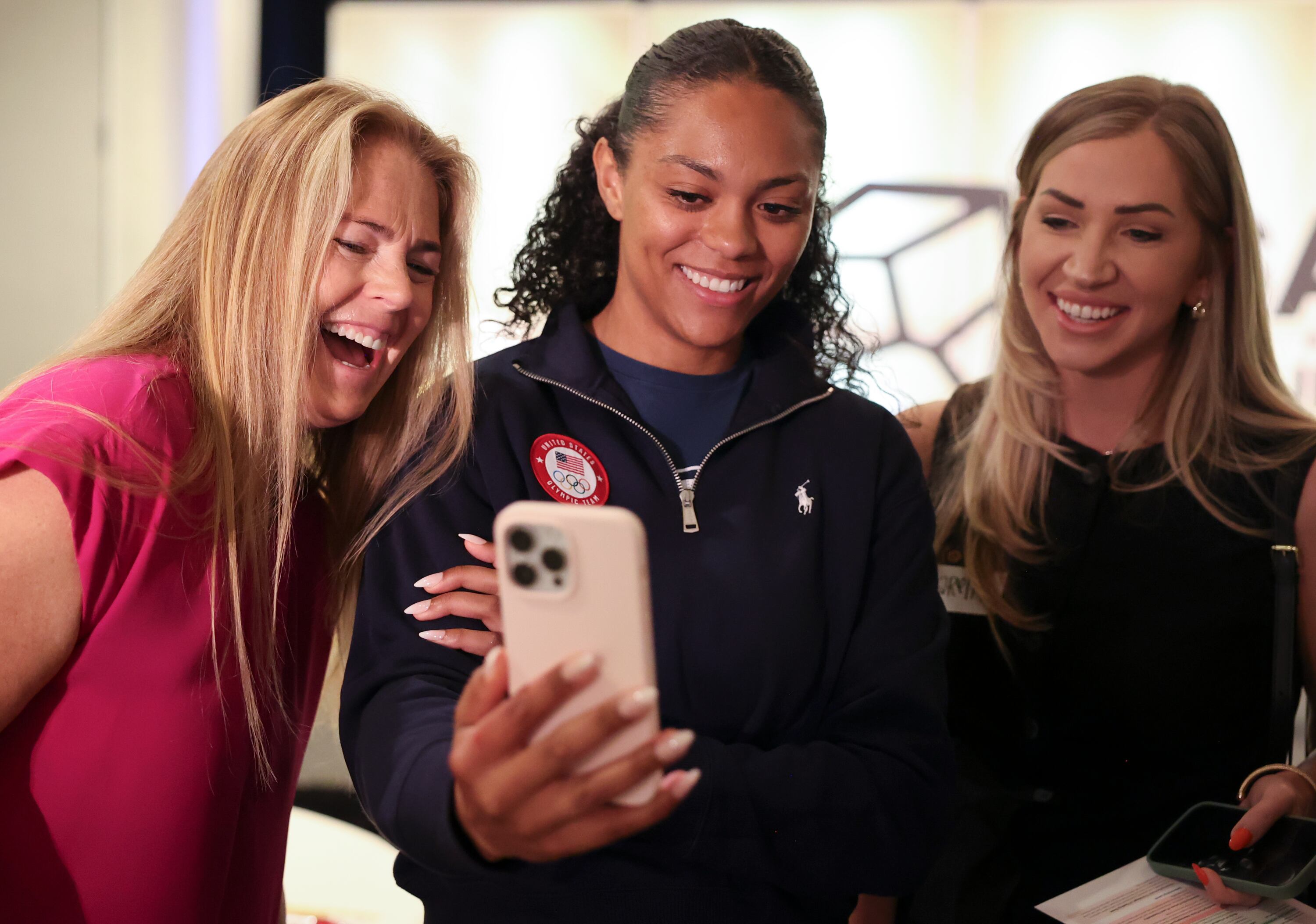Olympic skier Picabo Street, Olympic bobsledder Kaysha Love and Karen Hawkins watch a video of Love’s signature handshake at SALT Summit at the Salt Lake Marriott Downtown at City Creek Tuesday. Love started bobsledding when she was invited to a push camp in Lake Placid, New York.