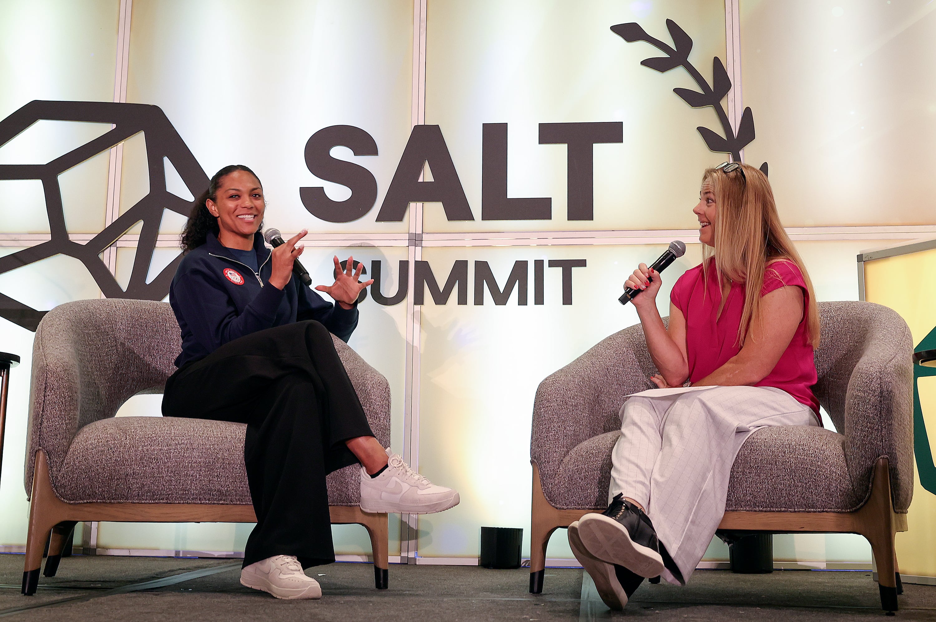 Olympic bobsledder Kaysha Love and Olympic skier Picabo Street speak at SALT Summit at the Salt Lake Marriott Downtown at City Creek on Tuesday. Love is looking forward to the 2026 Winter Games in Milan-Cortina, Italy.