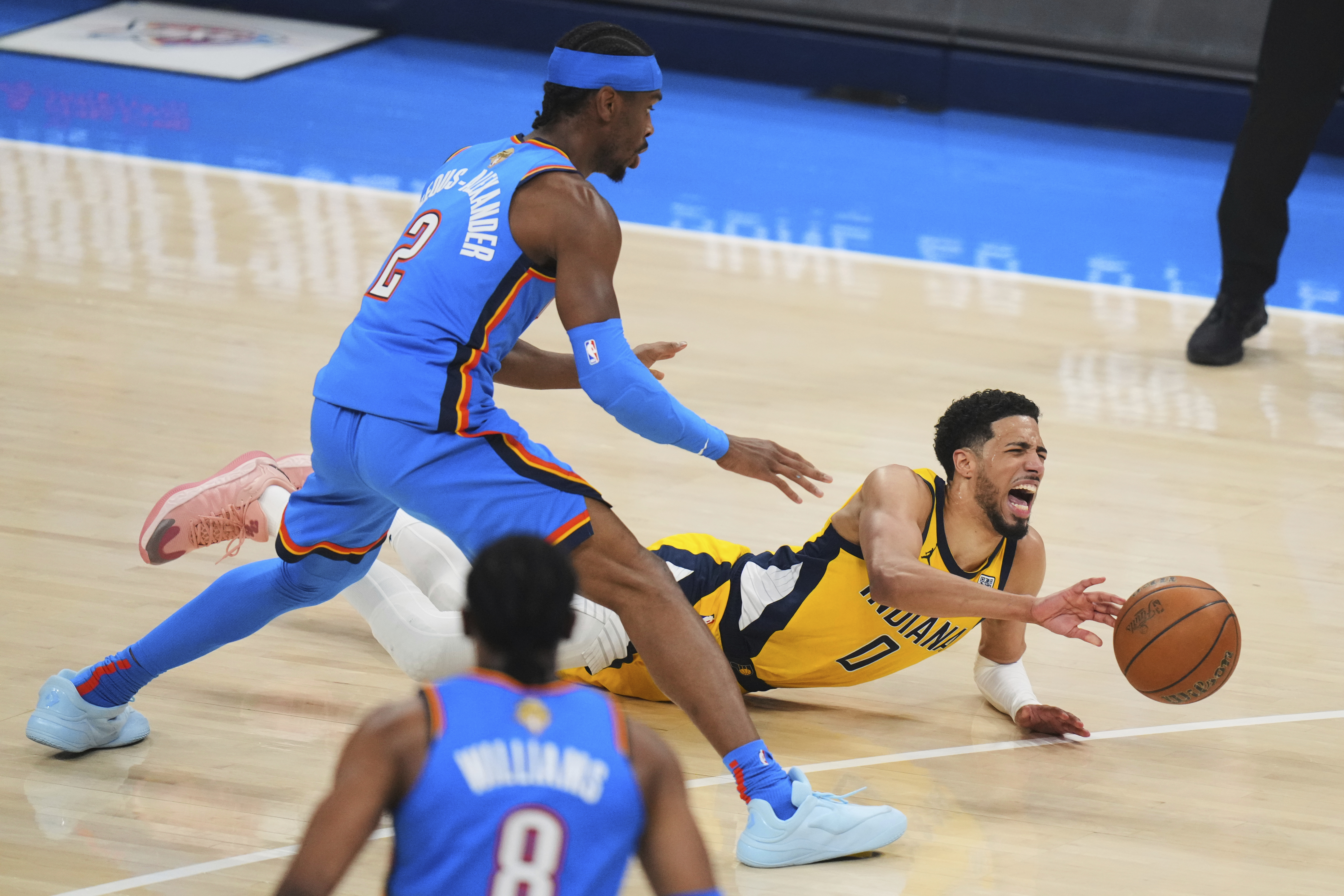 Indiana Pacers guard Tyrese Haliburton (0) falls to the court with an injury during the first half of Game 7 of the NBA Finals basketball series against the Oklahoma City Thunder Sunday, June 22, 2025, in Oklahoma City.