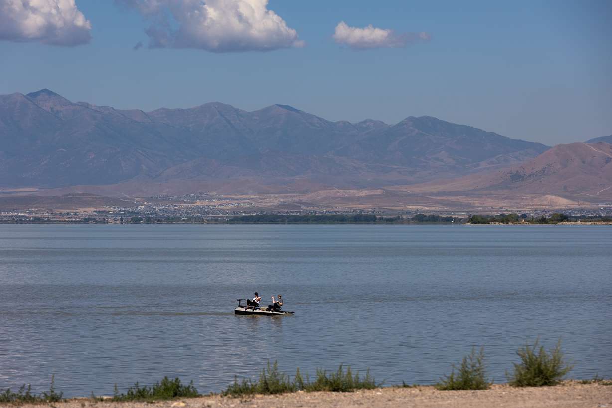 Boaters float along Utah Lake by the Lindon Marina in Lindon on Aug. 22, 2022.
