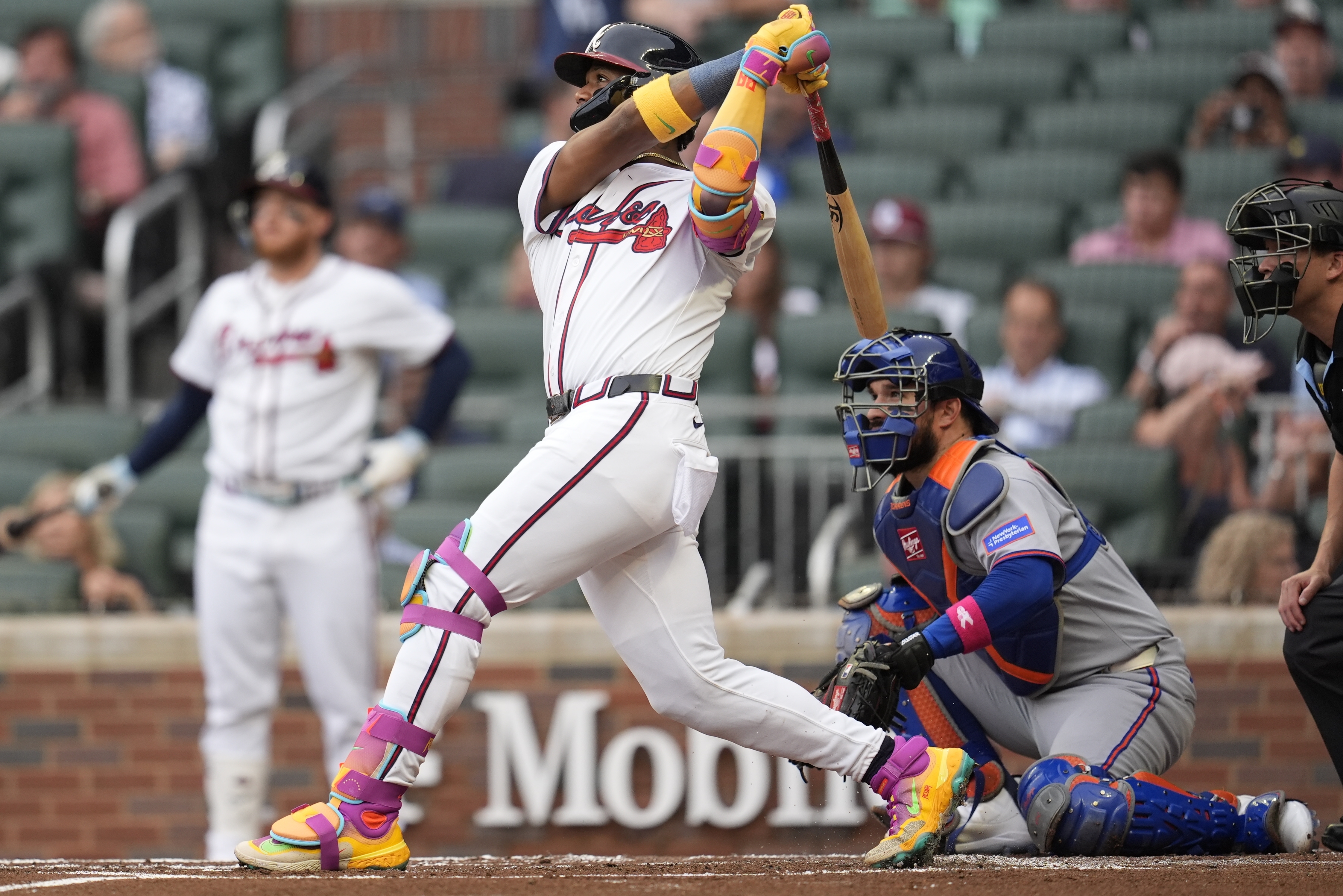 Atlanta Braves outfielder Ronald Acuña Jr. (13) hits a solo home run against the New York Mets in the first inning of a baseball game, Wednesday, June 18, 2025, in Atlanta. 