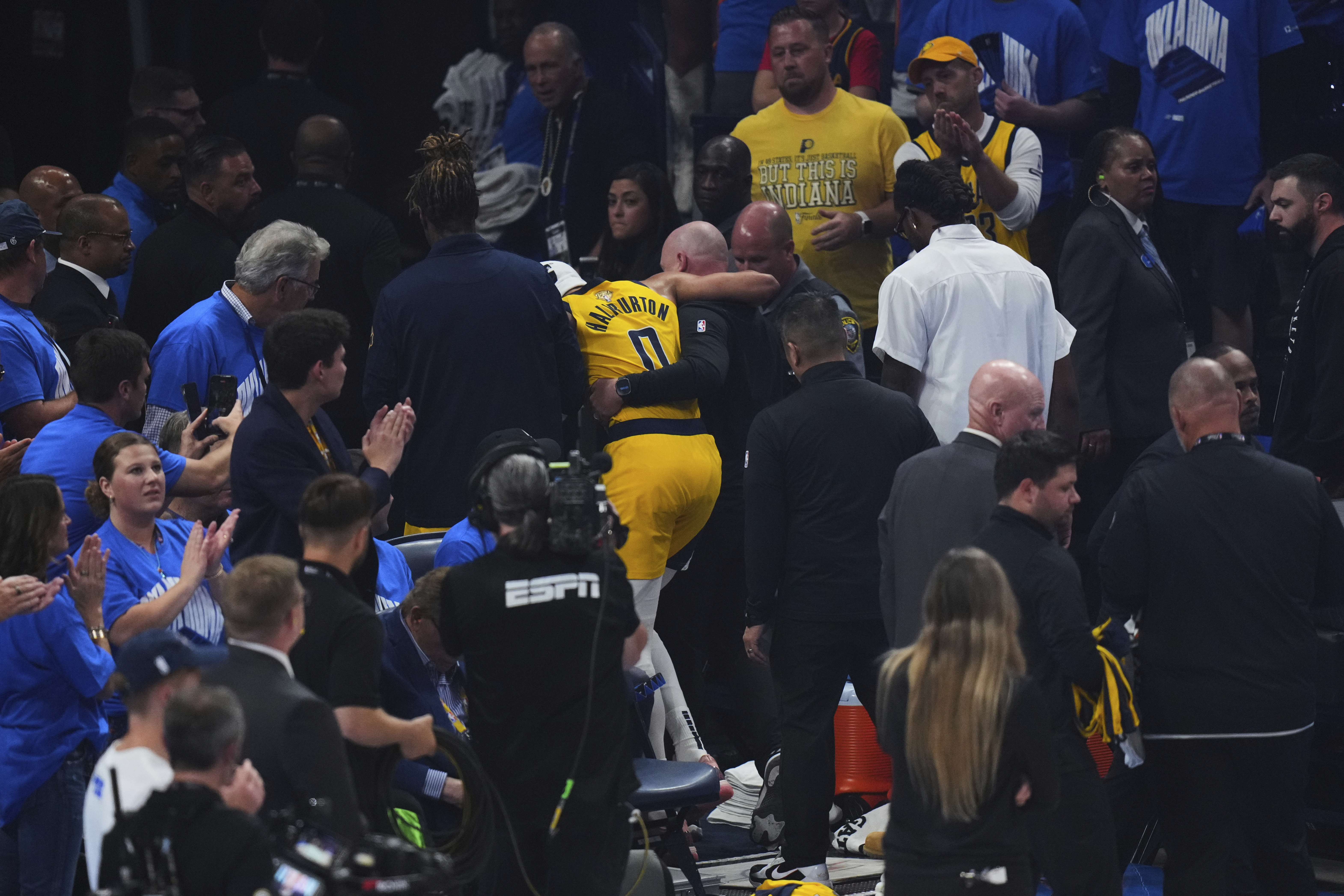 Indiana Pacers guard Tyrese Haliburton (0) leaves the court with an injury during the first half of Game 7 of the NBA Finals basketball series against the Oklahoma City Thunder Sunday, June 22, 2025, in Oklahoma City.