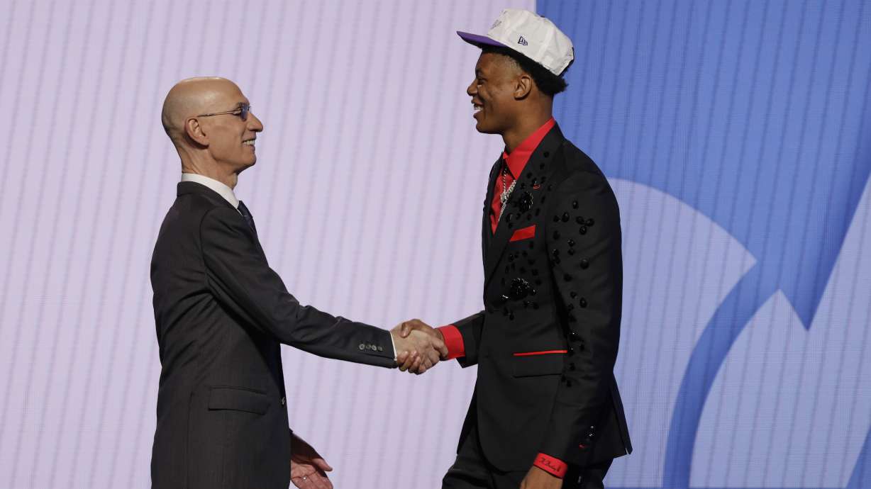Ace Bailey greets NBA commissioner Adam Silver after being selected fifth by the Utah Jazz in the first round of the NBA basketball draft, Wednesday, June 25, 2025, in New York.
