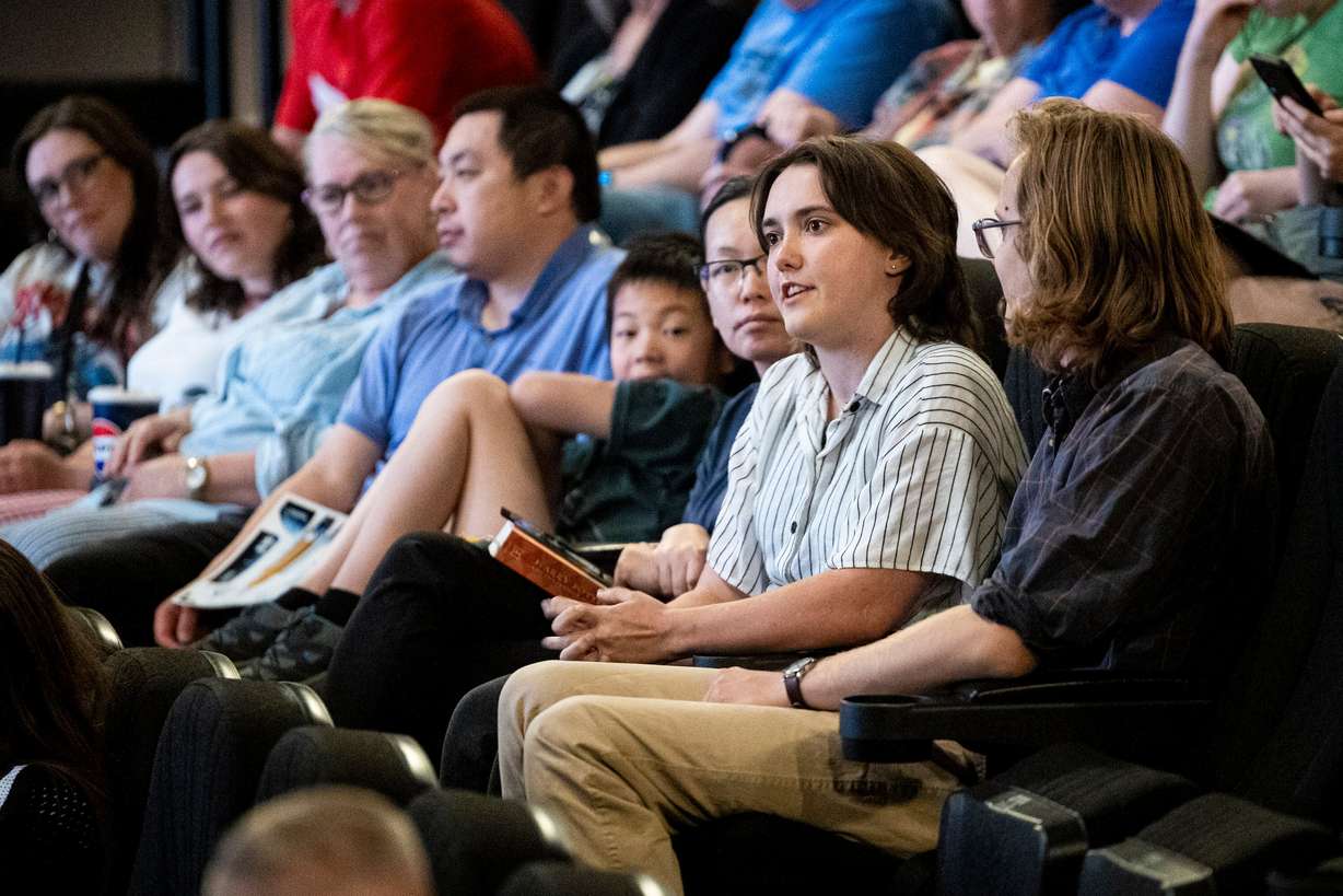 Lilly Samples, of Salt Lake City, asks a question during a panel discussion to showcase how local companies and innovators are contributing to NASA’s Space Launch System that will launch the Artemis II mission, held at the Clark Planetarium on Tuesday.