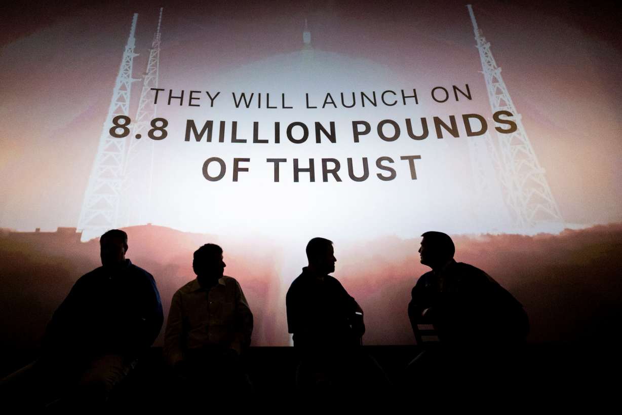 A panel watches a promotional video from NASA during a discussion to showcase how local companies and innovators are contributing to NASA’s Space Launch System that will launch the Artemis II mission, held at the Clark Planetarium on Tuesday.