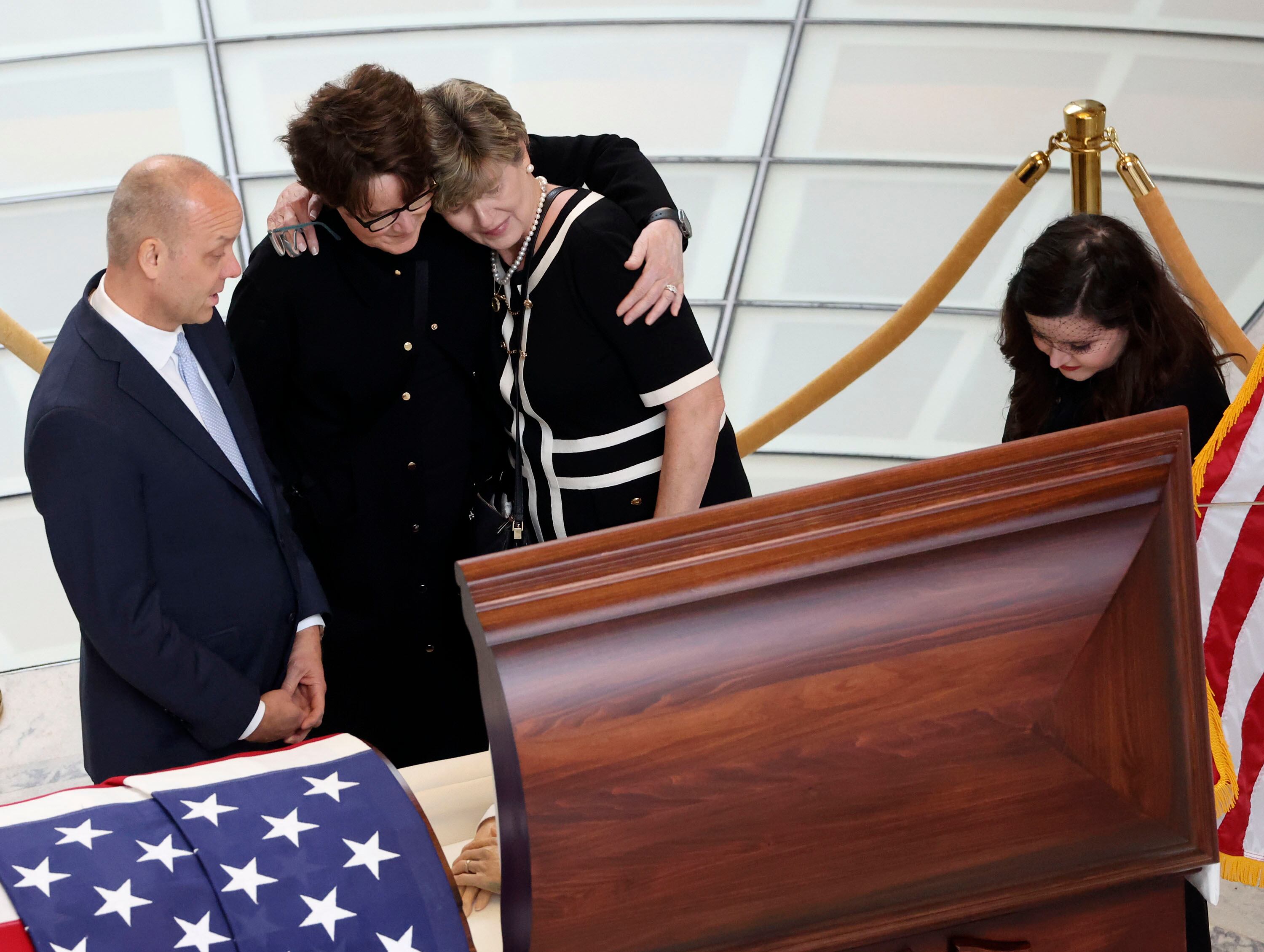 Former Sen. Orrin Hatch’s Chief of Staff and Orrin G. Hatch Foundation Executive Director Matt Sandgren, Sen. Hatch’s daughter-in-law Wendy Hatch, Hatch Foundation Community Relations Director Melanie Banks, and Sen. Hatch’s granddaughter Cyd Hatch pay their respects prior to a public viewing at the Capitol in Salt Lake City on May 4, 2022. Hatch, the longest-serving Republican senator in U.S. history, died April 23, 2022, at age 88.