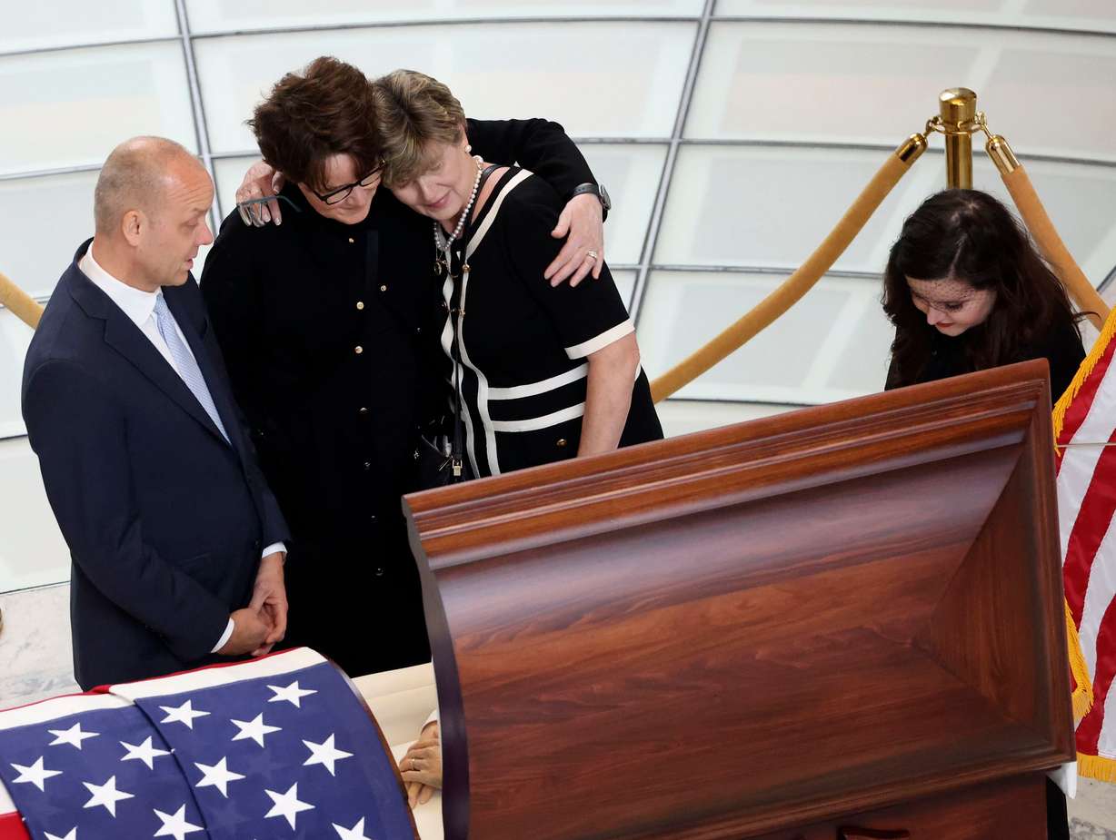 Former Sen. Orrin Hatch’s Chief of Staff and Orrin G. Hatch Foundation Executive Director Matt Sandgren, Sen. Hatch’s daughter-in-law Wendy Hatch, Hatch Foundation Community Relations Director Melanie Banks, and Sen. Hatch’s granddaughter Cyd Hatch pay their respects prior to a public viewing at the Capitol in Salt Lake City on May 4, 2022. Hatch, the longest-serving Republican senator in U.S. history, died April 23, 2022, at age 88.