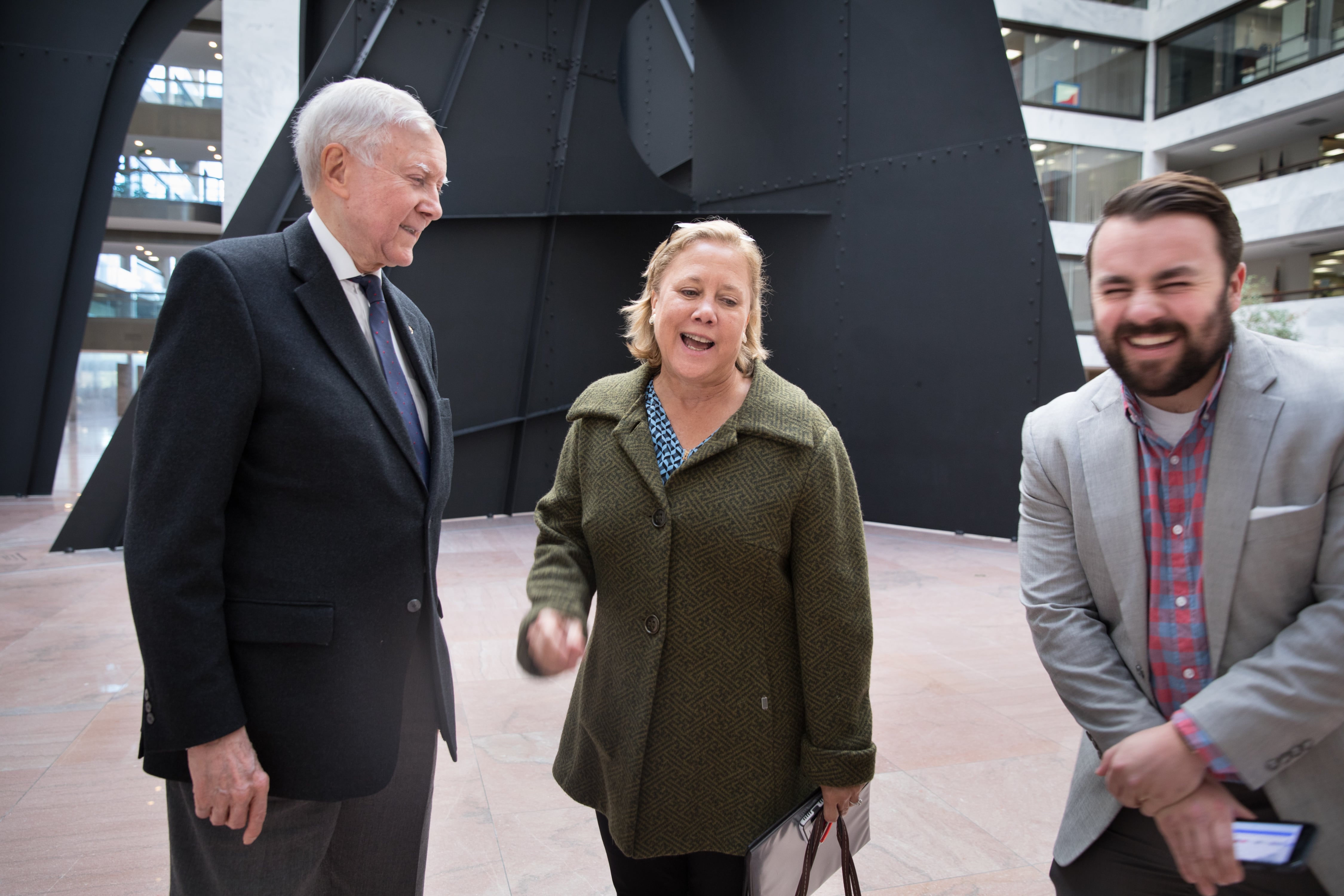 Former Louisiana Sen. Mary Landrieu, center, jokes with Utah Sen. Orrin Hatch, left, and Matt Whitlock, Hatch's spokesman, on Oct. 22, 2018.